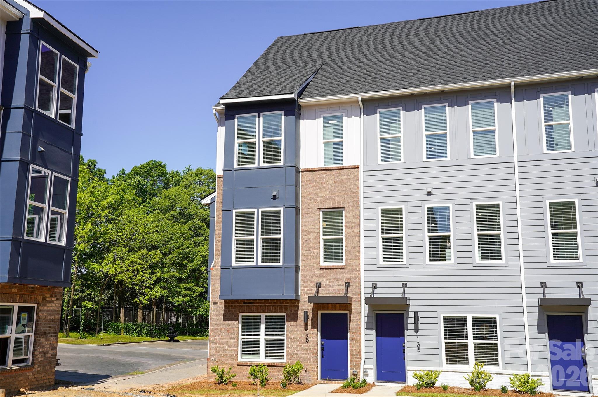 Brand new 4 story townhome overlooking community greenspace. End-unit with a private rooftop terrace and 2 car garage. Closing costs paid, all appliances and window blinds included. Over 1,600 Sq. Ft. thoughtfully planned out and designed to optimize your living and entertaining lifestyle. A spacious kitchen with countertop seating, a casual dining area, and a nicely sized family room with sliding glass doors to your private balcony. Upstairs, all 3 Bedrooms have their own en-suite bath and as always, we have expertly equipped this home with designer appointed features and finishes. Iron Creek is a new, luxury townhome community conveniently located in North End Charlotte. Minutes from Optimist Hall, less than a mile from the AvidXchange music factory, and only 2 miles from BOA Stadium.