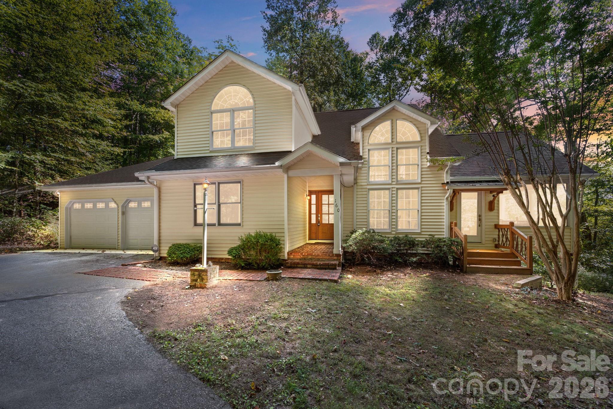 Escape to your own mountain retreat, where privacy, space, and modern convenience meet. Step through the front door into a welcoming foyer and be greeted by soaring vaulted ceilings and abundant natural light. The flexible main-level layout allows you to design the space as a family room or formal dining area, flowing seamlessly into a well-equipped kitchen and cozy wood-burning fireplace in family/den/dining area. An office, screened porch, and a beautiful four-season patio invite you to work, relax, or entertain while staying connected to nature. The primary suite is conveniently located on the main level with an en-suite bath, while two guest bedrooms, a full bath, and an airy loft complete the upstairs. The daylight basement provides abundant storage as well as a private guest or in-law suite with its own entrance. Outdoor living is equally inviting—enjoy morning sunrises, golden sunsets, or star-filled skies from multiple vantage points: the screened porch, Trex deck, stone patio, or all-seasons room with a peek-a-boo mountain view. Step directly outside to hike nearby waterfalls and trails, immersing yourself in the rich flora and fauna of this temperate mountain region. Practical upgrades ensure peace of mind and easy living, including a whole-house generator, high-speed fiber optic internet, a paved driveway, and a two-car garage.  All of the furniture and furnishings in the convey. Located just 5 miles from the charming town of Saluda, 30 miles to Greenville, 40 miles to Asheville, and less than two hours to Charlotte, this home offers both seclusion and convenience.