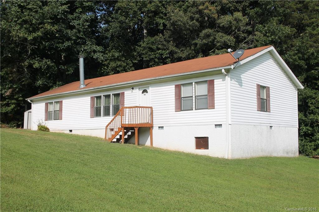 Step inside this well maintained 3 bedrooms 2 bath manufactured home on a large corner lot in a quiet neighborhood. Master on main with large bathroom, garden tub, and walk-in closet.  Kitchen with beautiful cabinets and Laundry room with an access to backyard. Dining room access to back porch. Wood burning fireplace. Freshly painted and new carpet installed throughout house. MOVE-IN-READY!