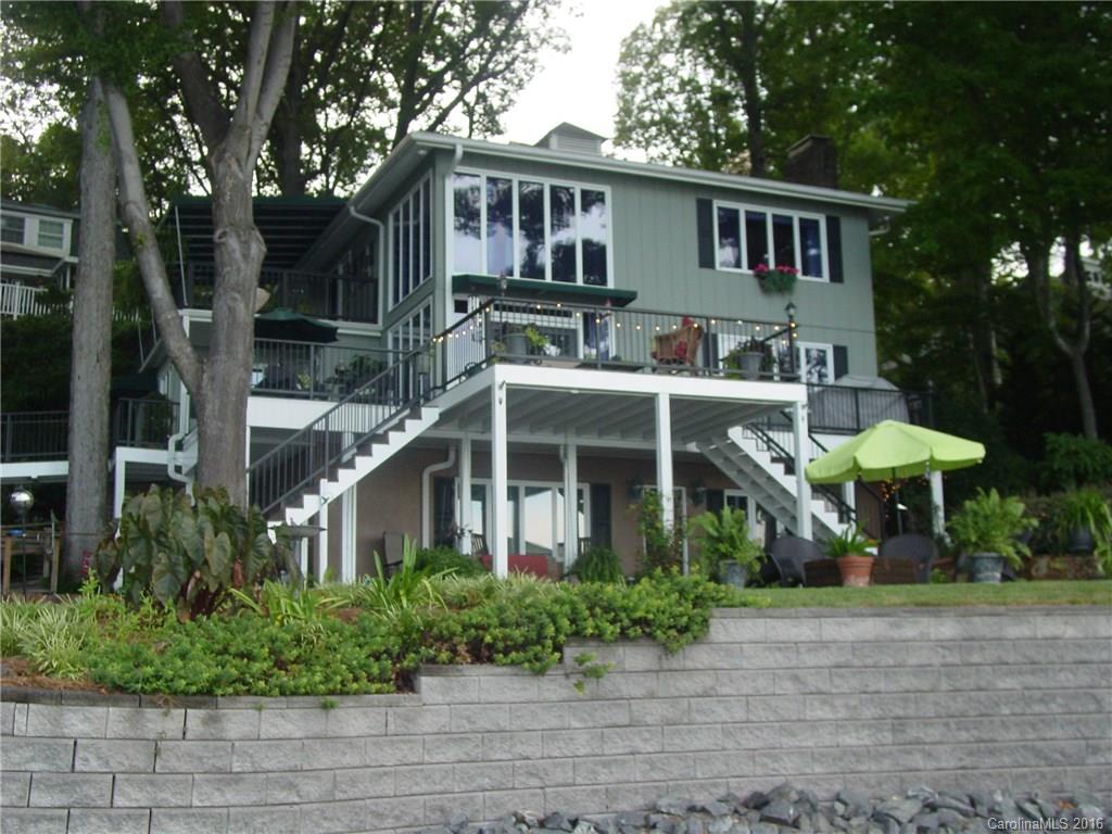 Completely updated waterfront home. Main water channel. All new kitchens and baths. Wrap around deck, covered balcony, all new wrought iron outside and inside. Neutral colors. Ready to move in. Stacked lot, but ample parking at bottom of drive. 3 car parking spaces. Manicured lawn. Outdoor fire pit and patio area