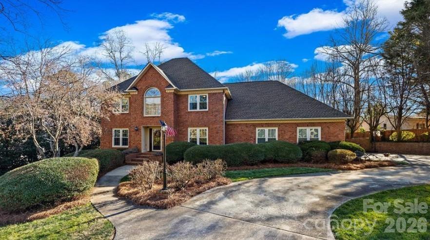 Welcome to the timeless elegance of Shiland Hills, where this stately brick home offers a lifestyle of comfort, leisure, and total peace of mind. Arrive via the circular driveway leading to a spacious three-car garage, offering plenty of room for vehicles and hobbies alike. Inside, the home is designed for effortless hosting, from dinners in the formal dining room with its elegant tray ceiling to casual gatherings in the heart of the home. Imagine relaxing evenings in the spacious master bedroom, curled up by the glow of your private brick-arched fireplace before stepping into the spa-like bath for a soak in the air-jet tub. Whether you are working from the main-level office or enjoying a movie night in the bonus room, there is a dedicated space for every activity. Outside, your private oasis awaits; spend your summers lounging by the salt water pool or hosting BBQs on the expansive deck within your privacy-fenced backyard. The sunroom provides the perfect spot to enjoy the view in any season. Shiland Hills is an established, sought-after neighborhood that has events throughout the year and is conveniently located just minutes from I-77, shopping, dining, and downtown Rock Hill. With major updates including a new roof (2024), pool liner (2025), and energy-efficient windows (2023), this home is as smart as it is beautiful.
