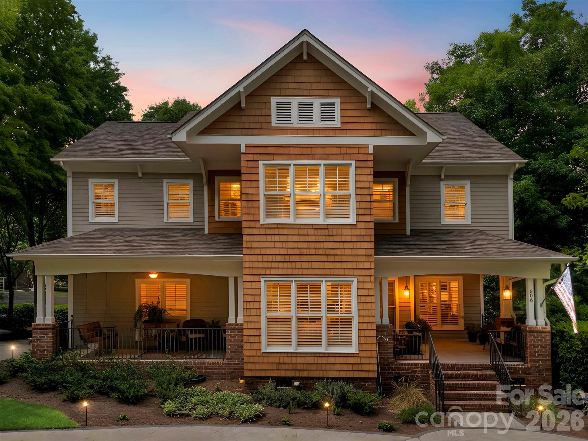 This is the one you won’t want to miss! Welcome home to the highly desirable Lakeshore community of Tega Cay. From the moment you arrive, you’ll be charmed by the home’s inviting curb appeal, highlighted by dual front porches. Inside, this two-story home features a large, open gourmet kitchen designed for both everyday living and entertaining, complete with granite countertops, a huge breakfast bar with seating, a center island for prep, double ovens, gas cooktop, stainless steel appliances, walk-in pantry, abundant storage, and a popular built-in pellet ice maker. The bright breakfast room opens directly to a partially covered deck, creating seamless indoor-outdoor flow. Step outside to your own backyard oasis—an expansive deck overlooking a large wooded corner lot, complete with a built-in jacuzzi that conveys. The added side yard is the perfect place to park your boat, and you’ll love the close proximity to the marina for easy lake access. Professionally designed landscaping, hardscape, in-ground irrigation, and landscape lighting make maintaining and enjoying this outdoor space a breeze. Upstairs, the spacious primary suite offers a private retreat with a large ensuite bath featuring a walk-in shower and garden tub. Additional highlights include an enlarged laundry room with sink and cabinetry and a tankless water heater. Residents enjoy access to unmatched Tega Cay amenities—golf, lake access, community pool, recreation parks, playgrounds, plus you're zoned for top-rated Fort Mill schools. Schedule your showing today—this one truly has it all!