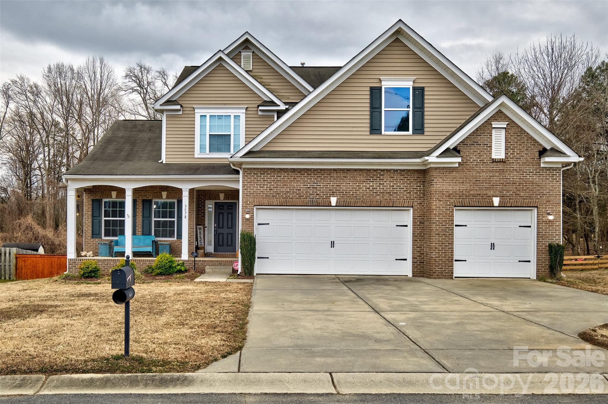 PRICE IMPROVEMENT!  COME LOOK AGAIN!  Welcome home to Lake Wylie, SC  and the premier Clover School District.  The home is right across from Crowders Creek Elementary school in Somerset Neighborhood.  This one checks all the boxes! Oversized 3 car garage with a built in work bench, BIG backyard that is fenced and has jungle gym that remains, raised planting beds, outbuilding and a double fence opening to get your toys out!  Primary bedroom on the main floor, open floorplan with cathedral ceiling in the great room, formal dining room and a breakfast area and lengthy bar to enjoy family dinners.  Upstairs offers 3 bedrooms, 1 bath and den/large loft area.  Literally has a rocking Chair front porch.  Cozy 4 season room and newer deck to enjoy the outdoors.  This home backs up to woods for additional privacy.  There is short walk or golf cart ride to the pool and amenity center.  Neighborhood also offers boat storage next to the pool area.  Easy commute to Rock Hill, Belmont, Gastonia and Charlotte.   The lake and York County Y is located within walking distance.  2 boat ramps within 3 miles to put your boat in the water too.  Come see this 1!
