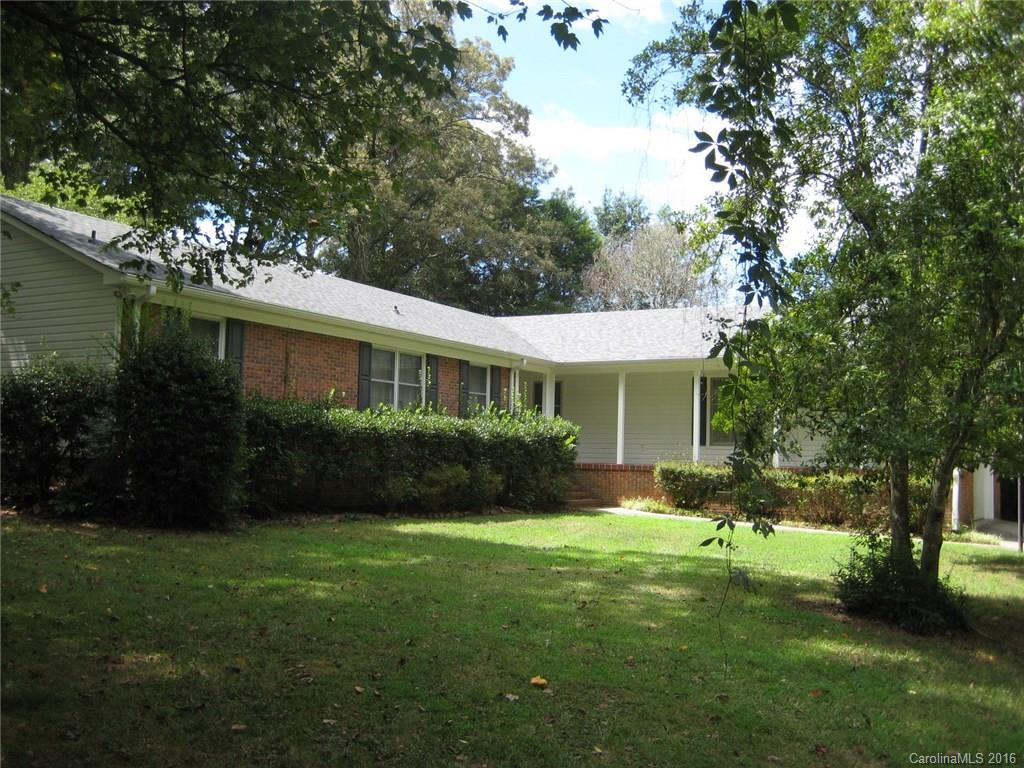 Brick and vinyl Ranch with spacious front porch, 4 BR's, formal dining & living room, kitchen with ton's of cabinets & counter space, walk in pantry, family room with Built-ins & fireplace with gas logs, screen porch & patio.  Roof (2015), gutters, garage door & opener replaced, 1 year warranty paid by Seller, nice wooded lot, great location.