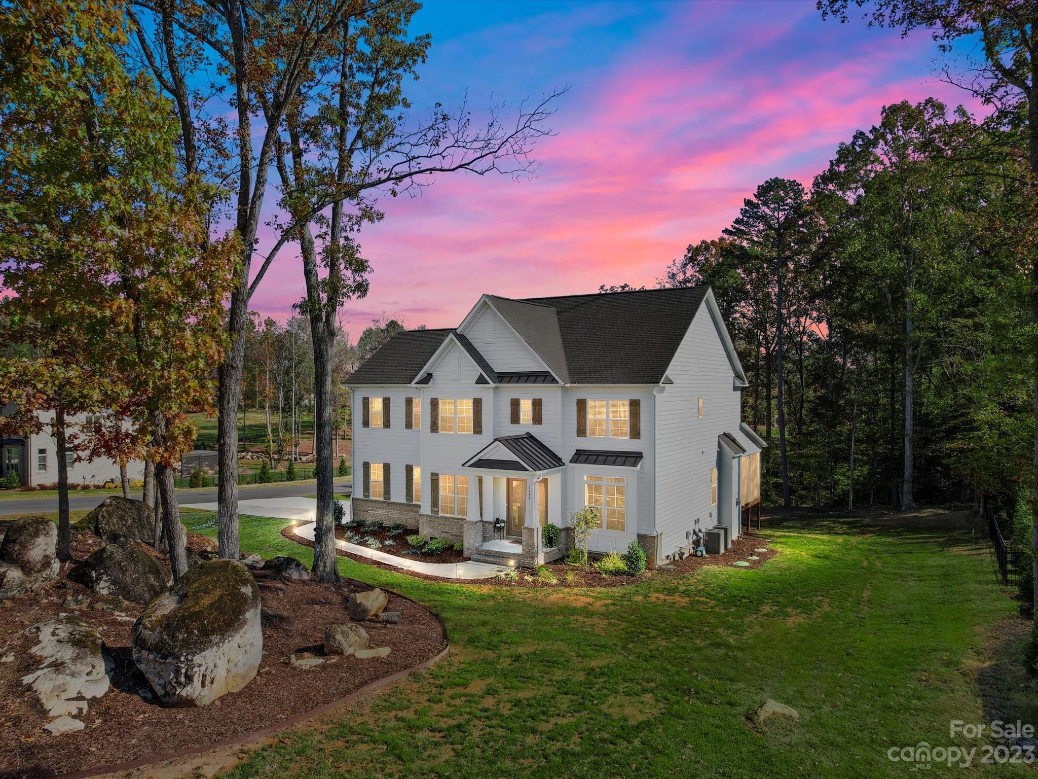 Welcome to this exquisite residence nestled on 1.39 acres in the highly sought-after neighborhood of Trinity Ridge. Step through the front door into a beautifully decorated space full of sophistication & warmth, enhanced by light-colored engineered floors that flow throughout the home. Beautiful dining room on your left & an office/bedroom on the right with full bath access. Stunning kitchen w/a modern, airy feel, stacked white cabinets, warm colored island, quartz counters, butler pantry & walk in pantry. The open flow to the great room surrounded by tons of natural light is ideal for entertaining. Extend your living space w/the screened porch that invites you to enjoy the outdoors without leaving the comfort of your home. It's the perfect spot for morning coffees or evening relaxation, enjoying the view of this deep, expansive 1.39 acre lot. Upstairs you'll find the primary suite, 3 additional rooms & a huge bonus room. Fort Mill schools w/Catawba Ridge HS.