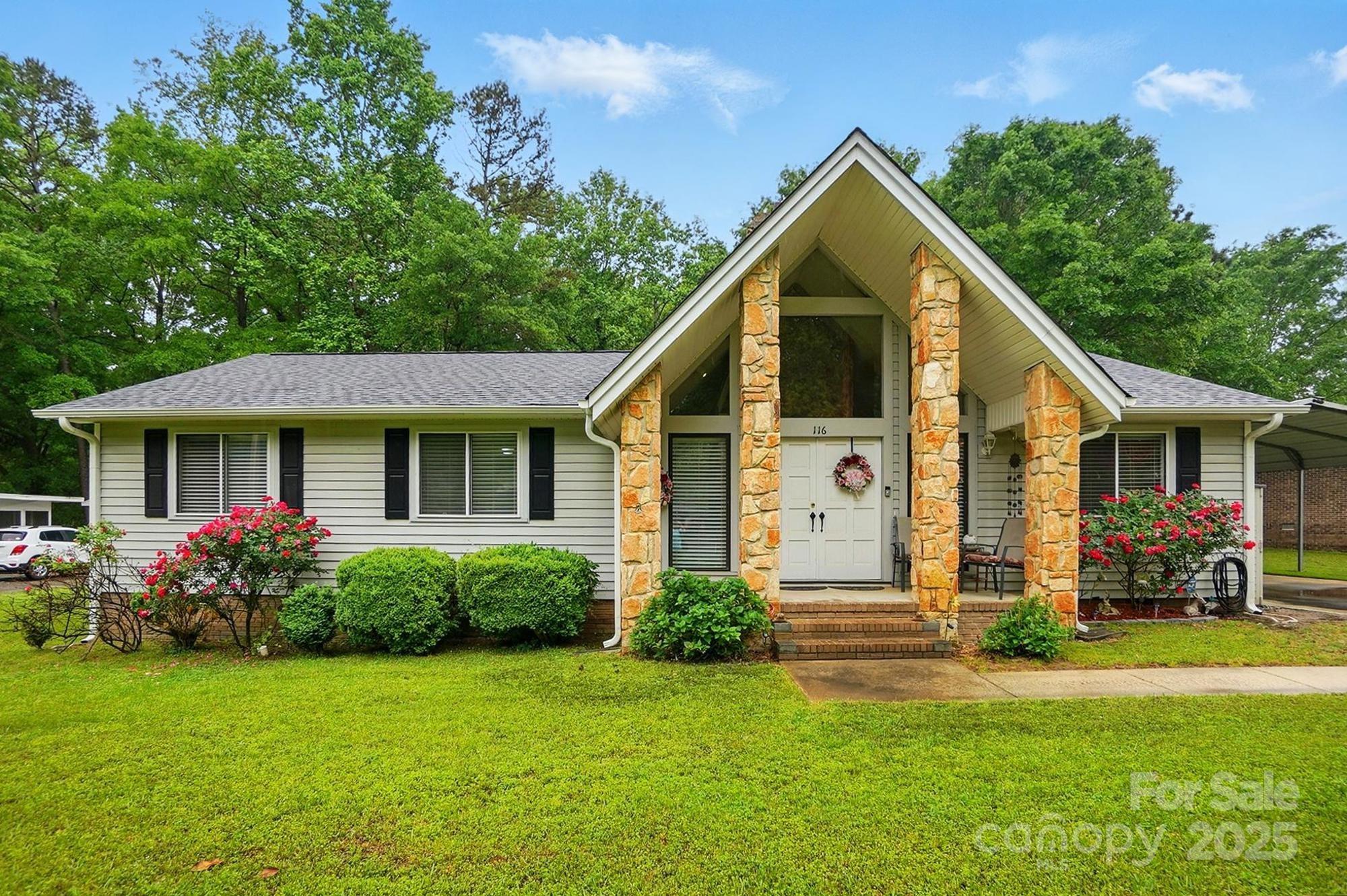 This delightful home in the wonderful Foxwood neighborhood offers a perfect blend of modern style & comfortable living, boasting recent renovations that will impress from the moment you step inside.  Be captivated by the 2 story stone fireplace and dramatic vaulted ceiling in the great room. The unique A-frame architectural design allows this impressive height to flow seamlessly from the front to the back of the house, creating an airy & spacious atmosphere. The former patio has been enclosed to create a fantastic screened porch. This wonderful space, trees and privacy fencing  provides the ideal space to relax, dine al fresco, & enjoy the Carolina breezes bug-free! Imagine sipping your morning coffee or unwinding after a long day in this serene space.
This charming home in a sought-after Fort Mill location offers more than just stunning updates. Enjoy the convenience of nearby amenities, excellent schools, and the welcoming community atmosphere that Fort Mill is known for.