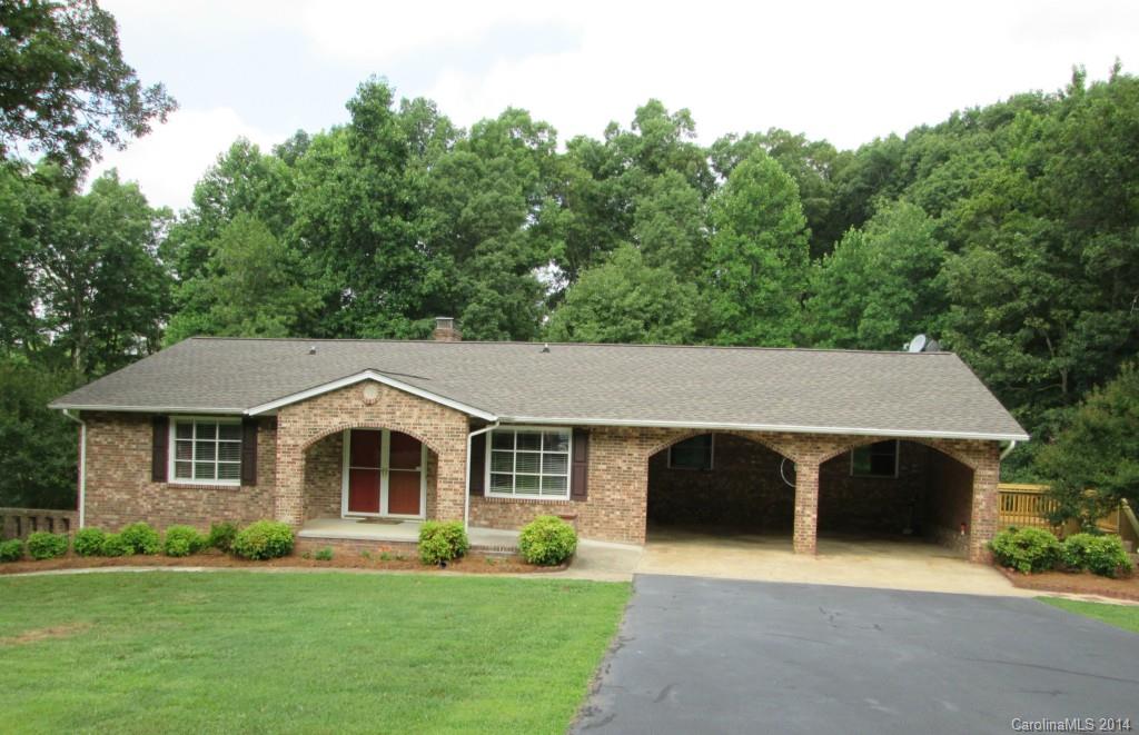 3408+/- heated sq. ft. Beautiful new deck, 2 acres. 3BR/2BA brick ranch with walk out finished basement. Beautifully updated kitchen with granite, 2 masonry fireplaces with gas log. Large heated workshop, spacious sunroom, master on the main floor - possible In-Law Qtrs, double carport garage. Roof only 5 yrs. old.