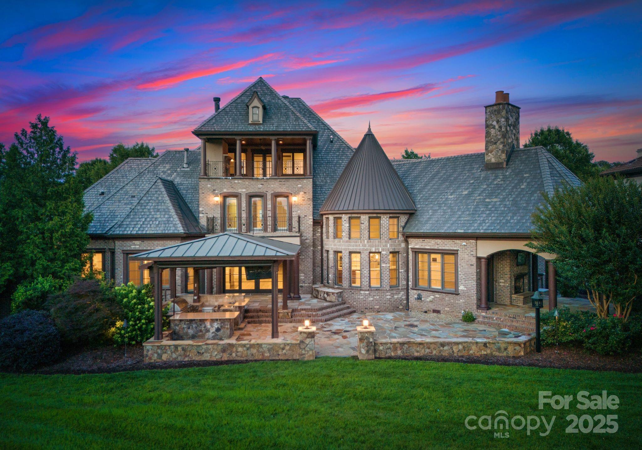 Experience refined luxury in this beautifully updated custom estate located in the gated Longview Country Club, with sweeping views of the Jack Nicklaus Signature golf course. Refreshed with refinished hardwoods, full interior paint, air duct cleaning, HVAC servicing, crawlspace enhancement, exterior power wash, and updated landscaping—this home offers a polished, clean-slate presentation for its next chapter.

Highlights include a richly paneled home office, main-level primary suite, guest suite, and an elevator to all levels. The gourmet kitchen features two new SS dishwashers. Upstairs offers a private theater, billiards room w/ full bar, and bonus room w/ wet bar, balcony and gas fireplace. Outdoor amenities include a covered terrace with gas fireplace, second covered patio with outdoor kitchen and grill, and a saltwater spa with waterfall—all set against tranquil pond and sunset views. Full golf membership required to enjoy Longview’s exclusive amenities (inquire for full list).
