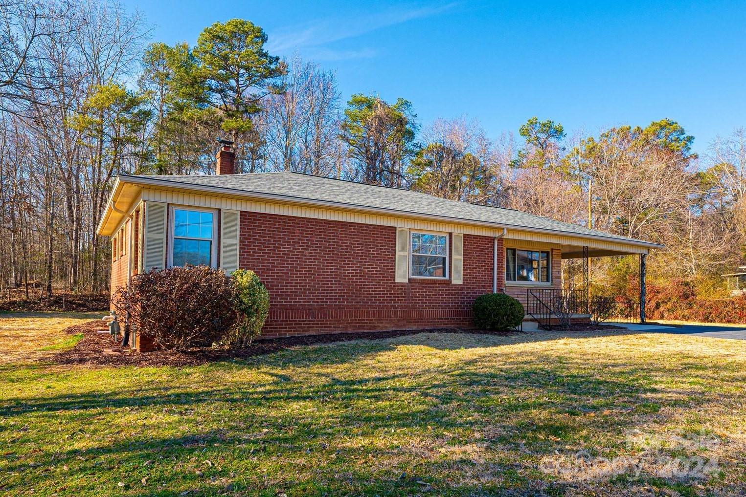 This renovated three bedroom home in NE Hickory shows like a brand new home! The covered front porch leads into an open great room with gleaming solid oak hardwoods, tons of natural light, and a dining area with coat closet. The kitchen features new marble-look LVP with new granite countertops, new stainless appliances and sink, new lighting, and doors to the covered rear deck and carport. All three bedrooms have new solid oak flooring and share a large hall bath with granite-topped vanity. Downstairs, enjoy a newly created laundry room with tons of space, plus over 1,000 SF of unfinished basement for your storage needs, or perfect for expansion! Additional updates include a brand new roof, brand new gas water heater, all new smooth drywall ceilings, all new PEX plumbing supply lines and new PVC waste lines, all new receptacles and light switches, all new door hardware, all new paint, updated lighting, and more! Convenient NE Hickory location with NO CITY TAXES!!