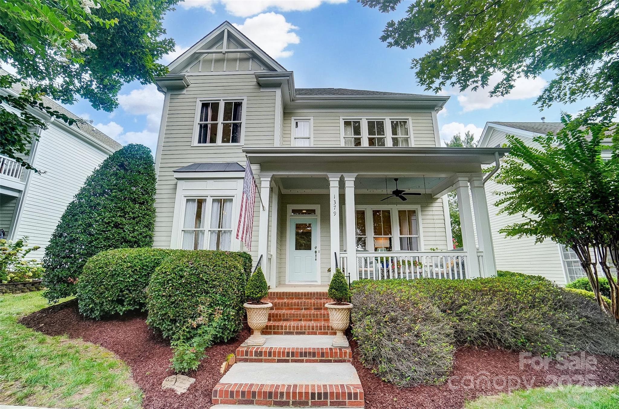 Welcome to 1379 Barnett Woods in the highly sought-after Baxter Village community in Fort Mill, SC! This charming 4-bedroom home with a loft offers over 2,400 sqft of airy, light-filled living. The inviting covered front porch welcomes you inside to gorgeous refinished hardwood floors and a thoughtful floor plan with the primary suite conveniently on the main level. The open living spaces make everyday living and entertaining a breeze. Upstairs, find three spacious bedrooms plus a versatile loft. Enjoy evenings on the lovely back patio surrounded by a private courtyard feel, or relax on the covered front porch across from an expansive community pocket park. With pools, trails, parks, dining, and shopping just steps away, and award-winning Fort Mill schools, this home is the perfect blend of comfort, location, and lifestyle!