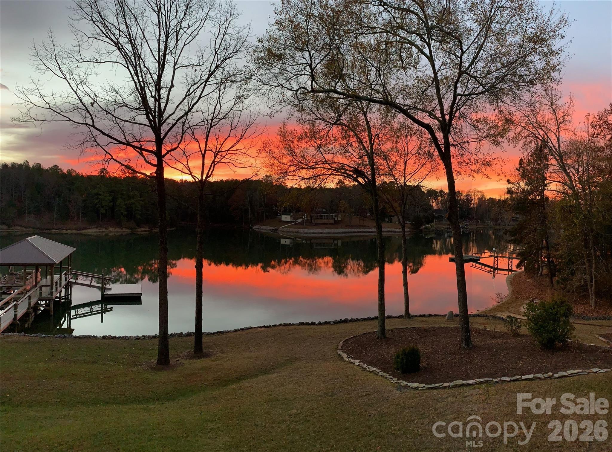 The views of Lake Wylie from this home are breathtaking and one of a kind. Deep water cove off of Big Allison offers beautiful privacy. The gentle slope to the newer boat dock with lift, port for jet skis (2), and floating dock are ready for you to enjoy all that lake living has to offer. Over 176feet of water frontage. Home has been remodeled inside and out. Kitchen w/granite countertops, SS appliances, and eat at bar, Family room has full views of the lake and open layout. Screened in porch on main level extends across the whole back of house for you to enjoy Lake Wylie nature and water views. Wraps around to the side of the home with new trek decking for easy maintenance and entertainment and enjoyment. Other improvements, new well with filtration system, new siding, gutters, and roof.