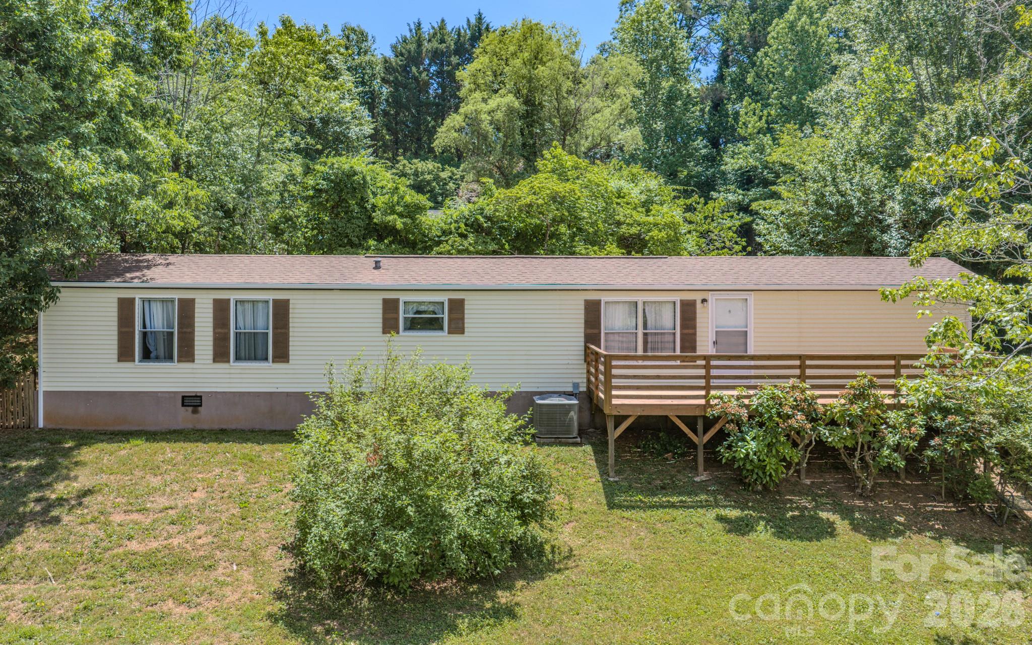 Affordable opportunity in desirable Alexander! Nestled on just over half an acre in a quiet subdivision with a peaceful country feel, this 2-bedroom, 2-bath manufactured home offers approximately 950 square feet of comfortable living space and plenty of potential. The split-bedroom floor plan provides privacy and functionality, while the spacious yard offers room for gardening, outdoor activities, or future enhancements. Whether you’re a first-time buyer looking for an affordable place to call home or an investor seeking a property with rental potential, this home is full of possibilities. With a few updates and improvements, it will provide an excellent opportunity to build equity and make the property your own. Conveniently located just minutes from Asheville, you’ll enjoy the perfect combination of rural charm, accessibility, and value.