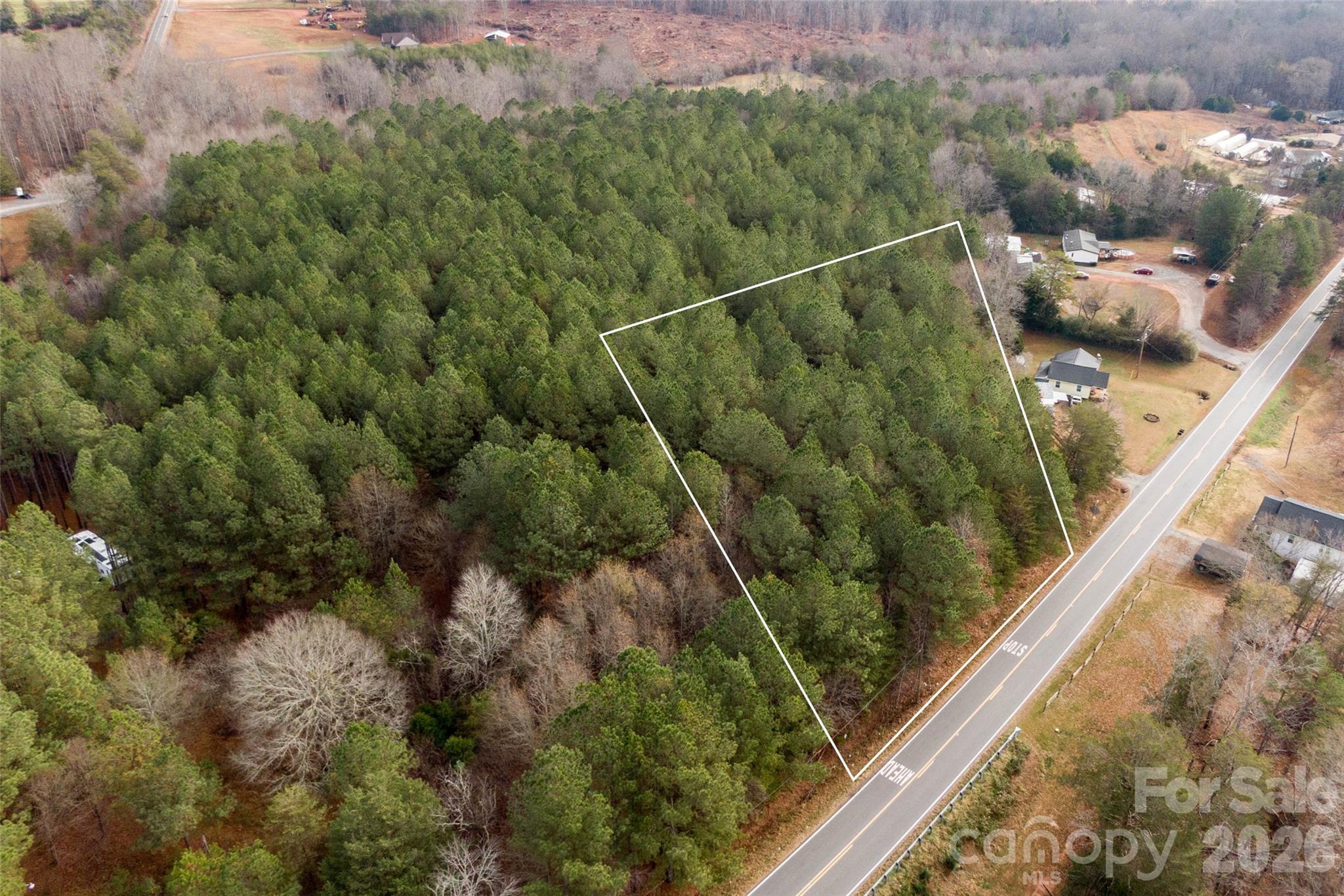 Discover the perfect blend of privacy and convenience with this wooded 1.72-acre lot located just outside the city limits. Enjoy the peaceful setting while remaining only minutes from shopping, dining, schools, and other daily necessities. The property offers flexibility for your future plans, allowing stick-built homes and doublewide manufactured homes, while singlewide homes are not permitted. With ample space and natural surroundings, this lot provides an excellent opportunity to build or place your ideal home in a quiet, country-like setting without sacrificing easy access to town amenities.