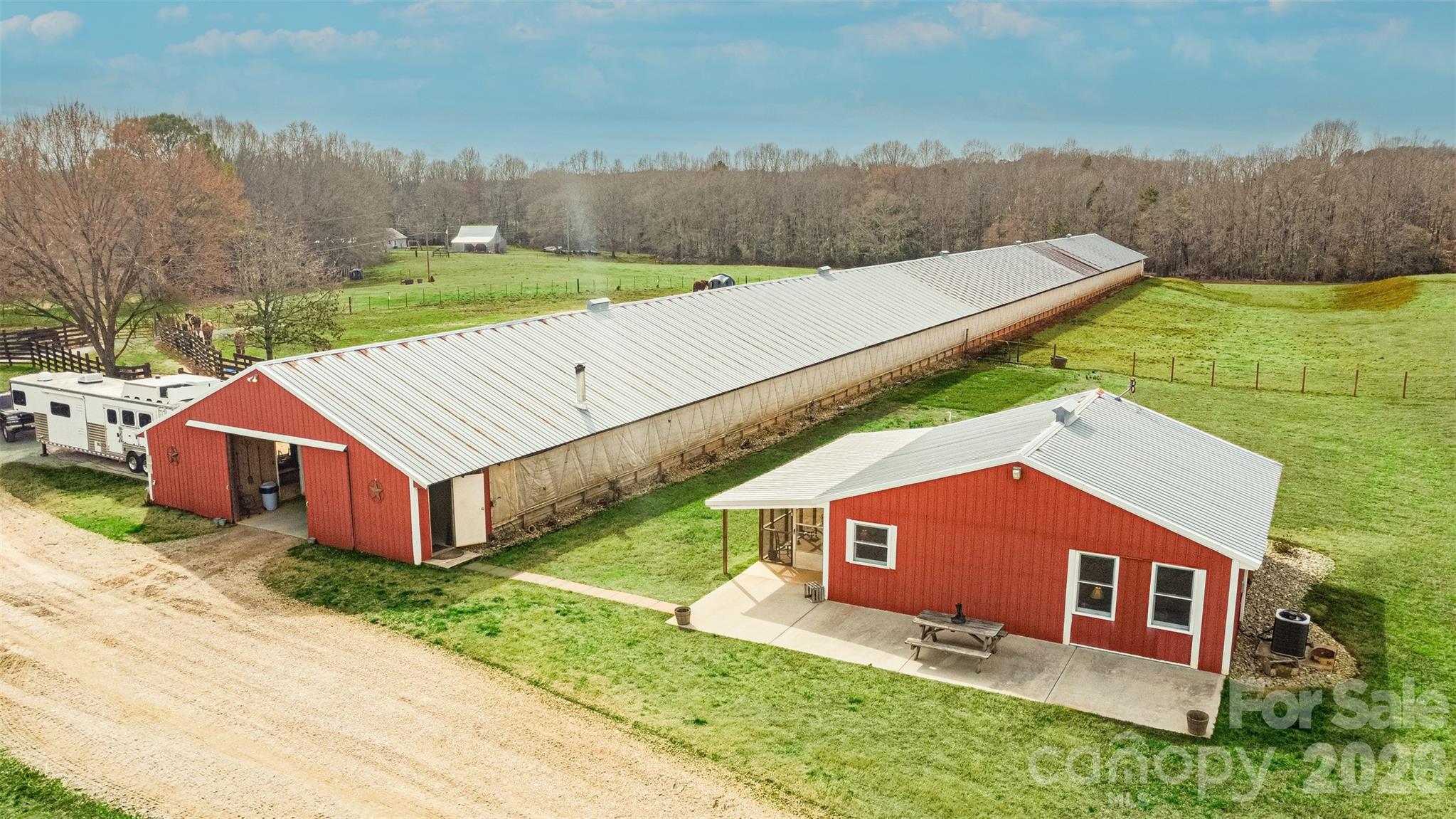 69+ acres with unlimited potential... investmentment, develop, venue, retreat, private estate. This established horse farm has an 800sq ft barndominuim with 2 bedrooms and 1 bath. The show stopper is the 400' x 45' barn with an entertainment area with woodstove, bar area, kitchen, bathroom and large gathering area. Beyond the entainment area, there are stalls, tack area, huge amount of storage large enough for boats, tractors etc AND a covered riding pen.  Multiple pastures make herd management simple. Property is bordered by a creek surrounded by beautiful hardwoods.  Multiple homesites to build your forever home. Chester County has verbalized that 50% of the property can be developed into 1+ acre septic lots without rezoning.  There are 2 separate areas of road frontage on Westbrooke Road wide enough for roads into the property. 
Seller is open to selling 50% of the acreage and retaining the other half with barn and residence.