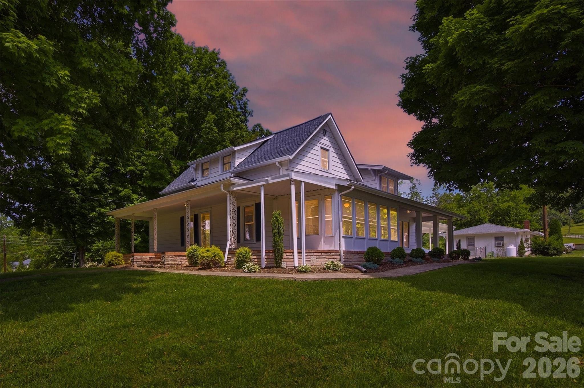 This beautiful home exudes historic charm and boasts stunning curb appeal, making it a true standout in the neighborhood. The open floor plan offers ample space, seamlessly blending modern updates with classic character. Natural hardwood floors flow throughout, enhancing the warmth and inviting atmosphere of the home. Enjoy updated bathrooms and a stylish kitchen that combines functionality with elegance. As well as a new hot water heater. The generous yard provides plenty of room for outdoor activities and relaxation, perfect for entertaining or unwinding in nature. Conveniently located just off Highway 321, this home offers quick access to Blowing Rock and Boone, making it an ideal base for skiing, hiking, mountain climbing, or indulging in local dining experiences. Additional highlights include spacious living areas filled with natural light, beautifully maintained exterior and landscaping, and close proximity to outdoor adventures and amenities. Don’t miss the chance to make this charming property your own!