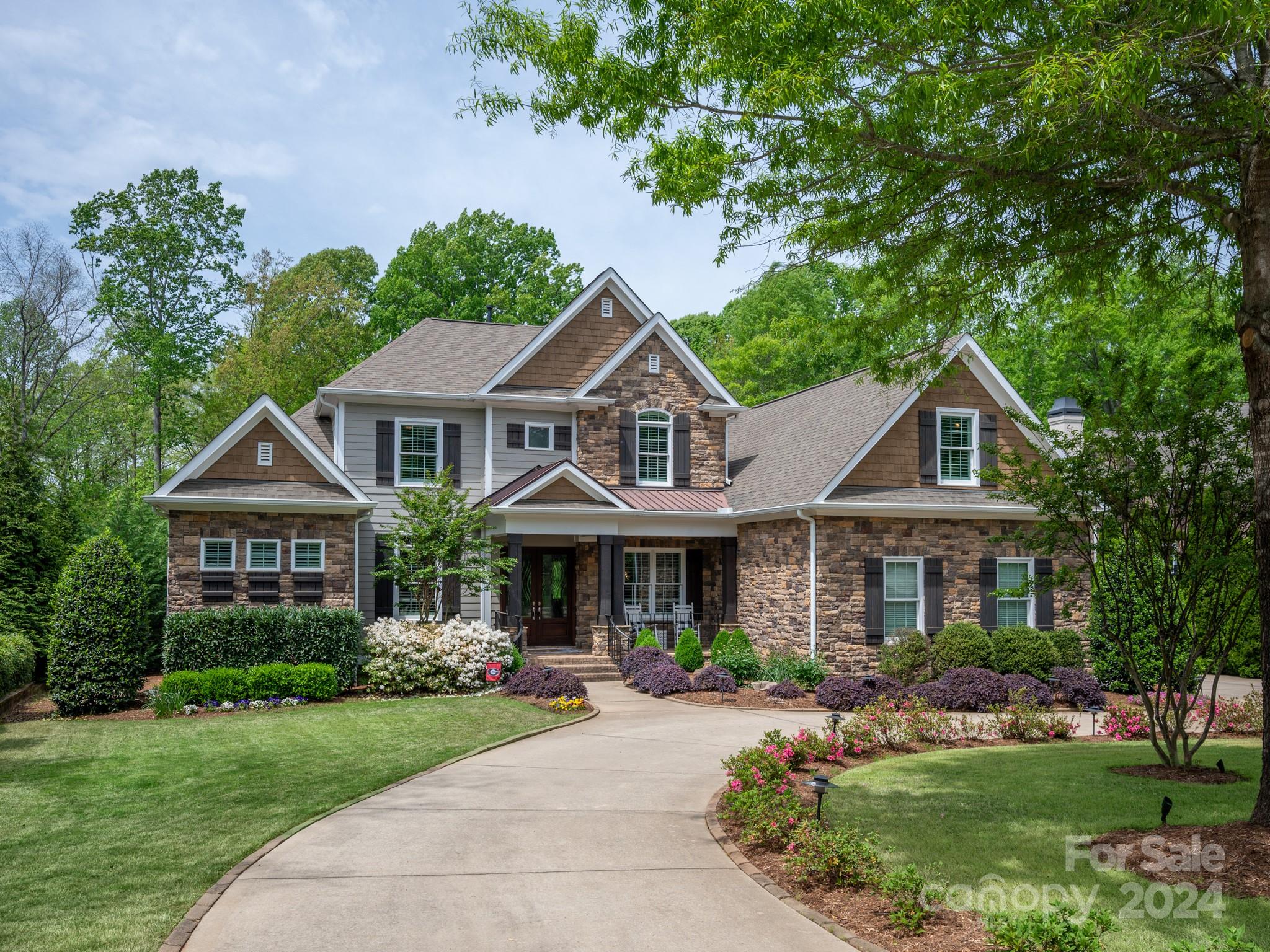 Amenity-rich Springfield is a premier neighborhood offering pools, clubhouse, playgrounds, tennis, pickleball, walking trails, activities, fitness center, public golf course, and award-winning schools! This Arthur Ruttenberg home has everything you desire and is an entertainers dream. Open concept floorplan with updated kitchen and baths, hardwood floors throughout entire home. Heavy moldings and tons of storage. 51' pool with jumping Rock and hot tub will accommodate fun pool parties. The circular driveway is an added bonus. A separate office allows you to work from home. Two bonus rooms upstairs with an observation deck to view the sunset and golf course. Three upstairs bedrooms have ensuite bathrooms. Backs to HOA owned land that is completely wooded and private. HOA dues include annual membership to Anne Springs Greenway located across from neighborhood that has 2,100 acres of nature preserve with countless activities; hiking, biking, horseback riding to picnics, kayaking and more.