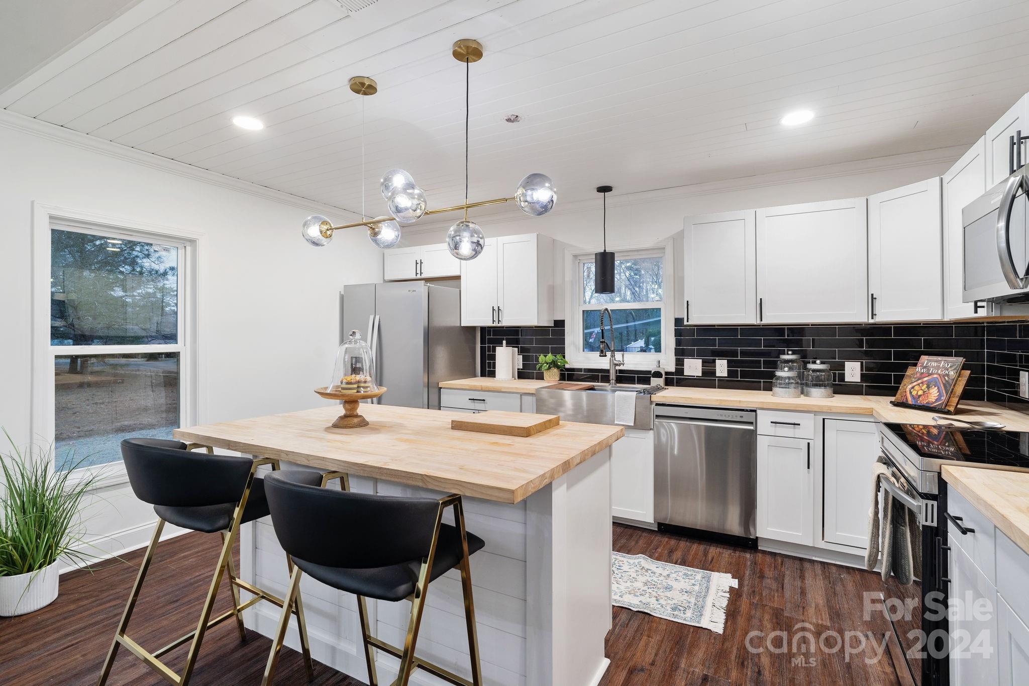 Freshly renovated RANCH home in a wonderful established neighborhood. Beautiful new LVP Flooring throughout this entire home. Open Floorplan! This modern kitchen with new cabinets, new counters, and new fixtures also features a center Island and full SS Appliance Package!  Down the hall you will find all the Bedrooms with Ceiling Fans. Guest Bath is impressive with Designer Tile  Primary Bath is all new with a double vanity, tub, and tile shower. NEW Windows/New HVAC. Come see this one!