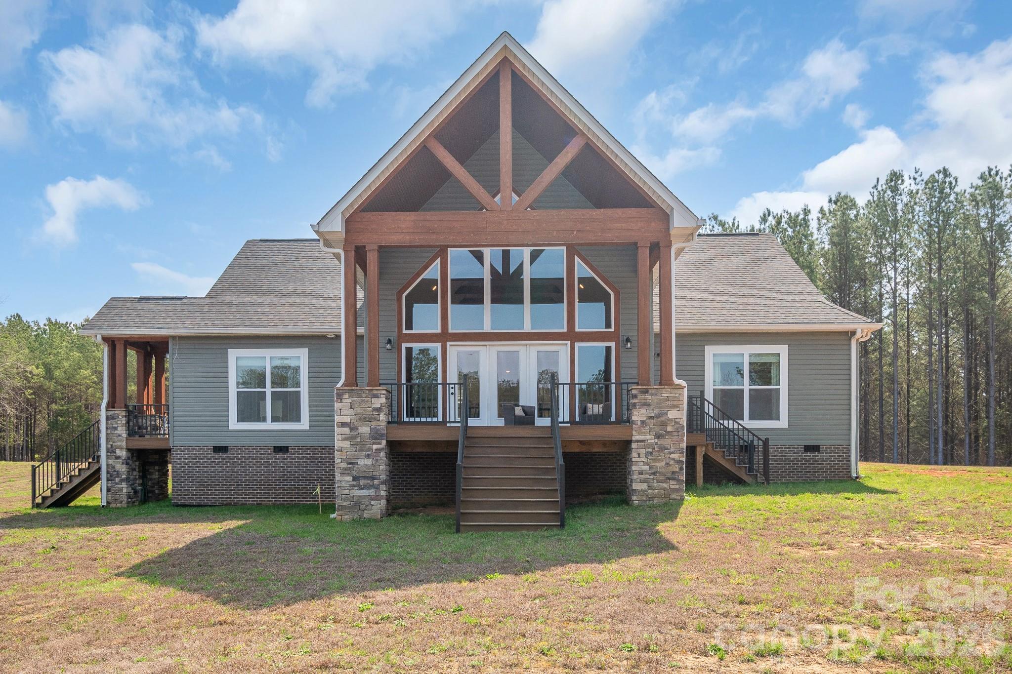 Start living the country life with complete privacy where all you hear are the birds and wildlife. This home is almost new with all the modern amenities. Large windows overlooking the peaceful pond fully stocked. Cook in the gourmet kitchen with a view as well. Beautiful hardwood flooring, no carpet for easy cleaning and looks beautiful. You will never want to leave the peaceful setting. Hunt and garden on your own property. Primary bath has a beautiful ceramic shower and a soaker tub. Underground power lines to for a clean look. Outside is equipped with a camper hookup.