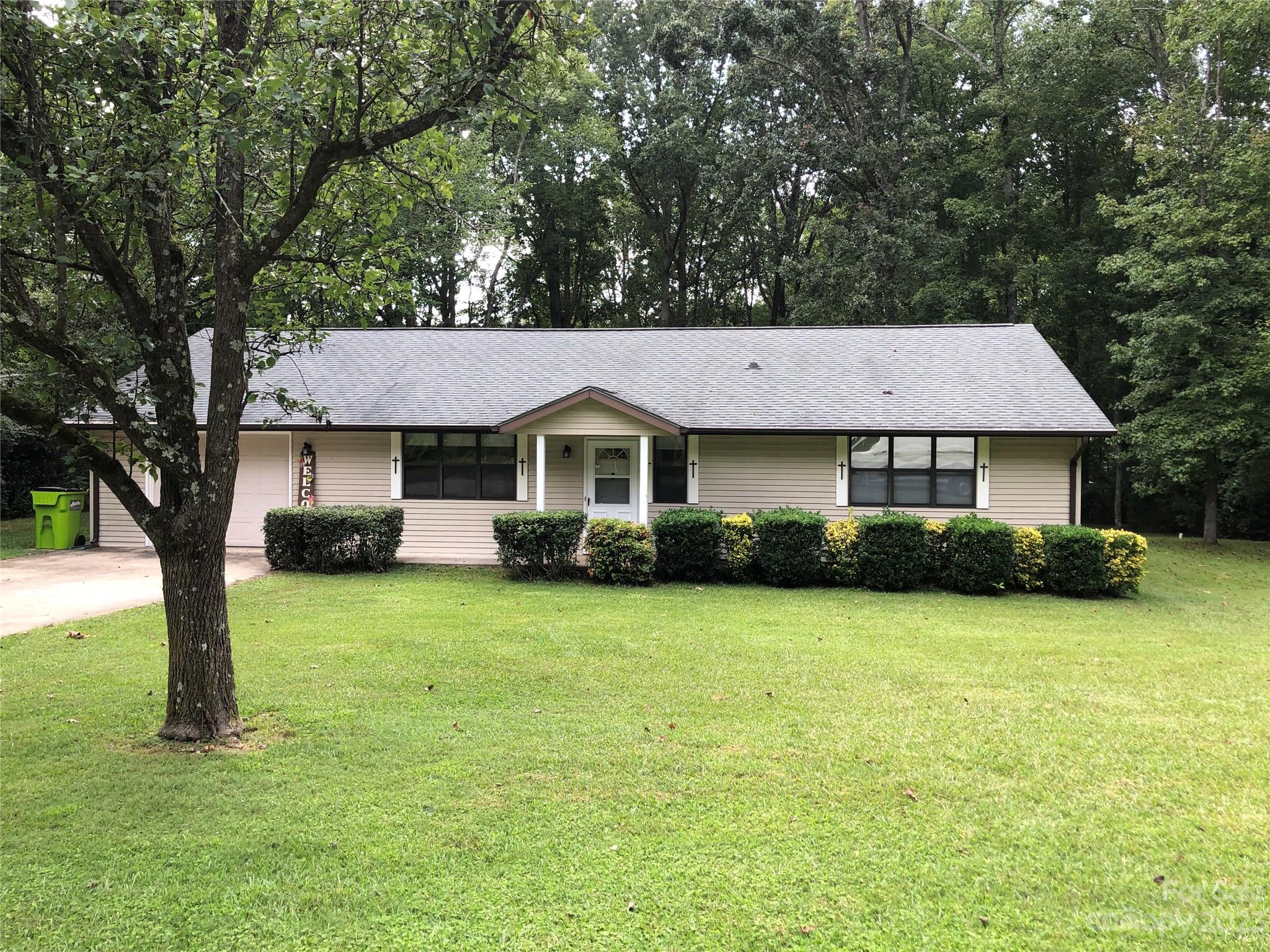 Nice ranch home in the country south of the town of Waxhaw.  2 bedrooms and 2 baths.  Attached garage. Two separate pulldown attic stairs.  One is in main part of home and the other is in the garage. Multiple outbuildings and a carport in back yard which isn't accessible from the driveway. Walkthrough video available from Listing Office upon request.