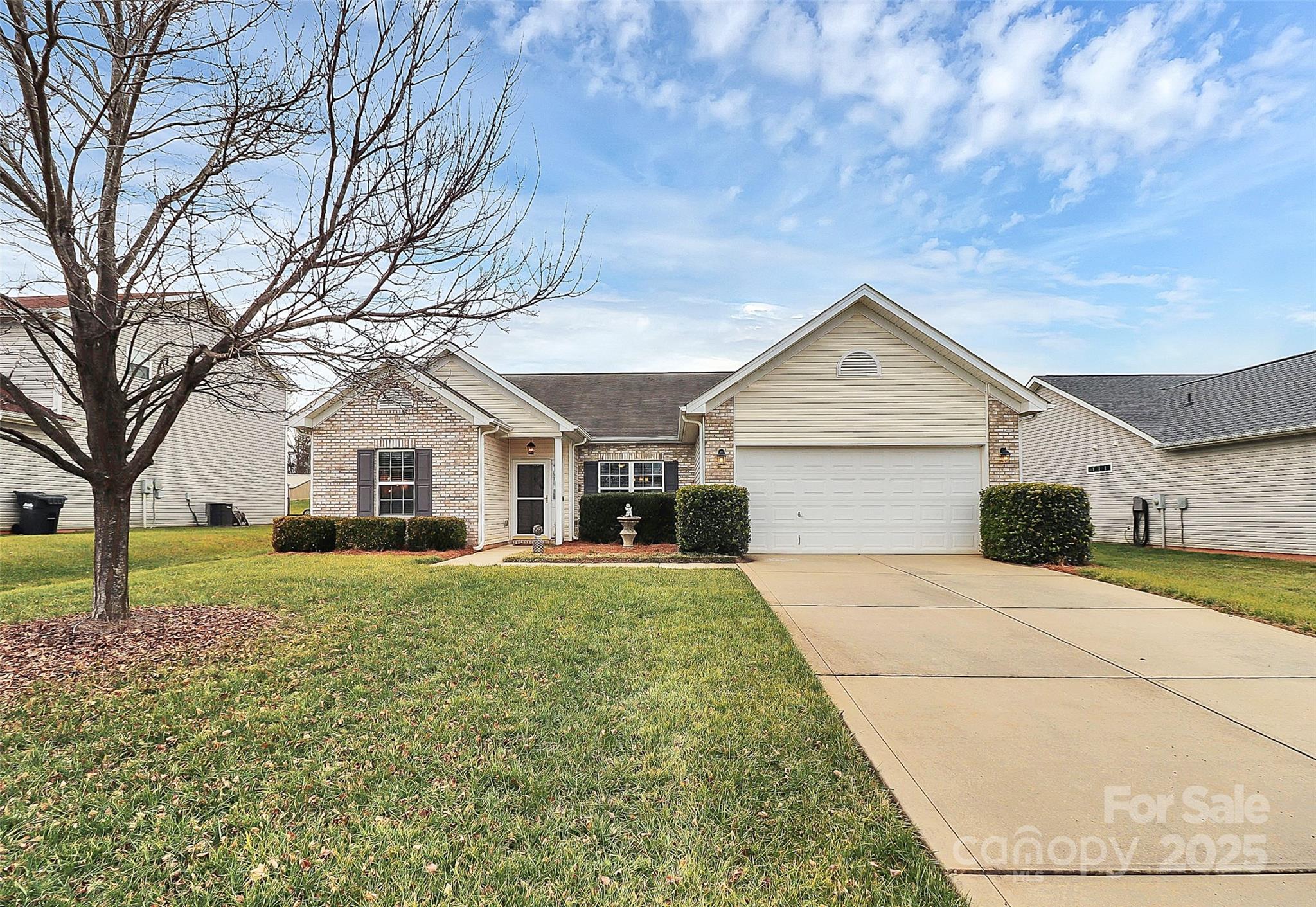 Discover comfort & style in this beautifully maintained one-level ranch home featuring a low-maintenance brick and vinyl exterior. Inside, you'll find neutral paint and luxury vinyl & tile flooring throughout, offering both elegance & durability. The open-concept design is perfect for entertaining, with a spacious dining room featuring a craftsman accent wall, seamlessly flowing into the living room w/ a vaulted ceiling & cozy gas log fireplace. The flex room, currently used as a home office, provides additional versatility to suit your needs. The kitchen features granite countertops & stainless appliances. Retreat to the primary suite, complete w/ bathroom featuring a walk-in shower, white cabinets, & an oversized closet. Two additional bedrooms offer generous space, each with walk-in closets for ample storage. Step outside to the oversized patio, perfect for relaxing or entertaining. Located in sought-after Fort Mill, minutes from shopping & benefits from low South Carolina taxes.