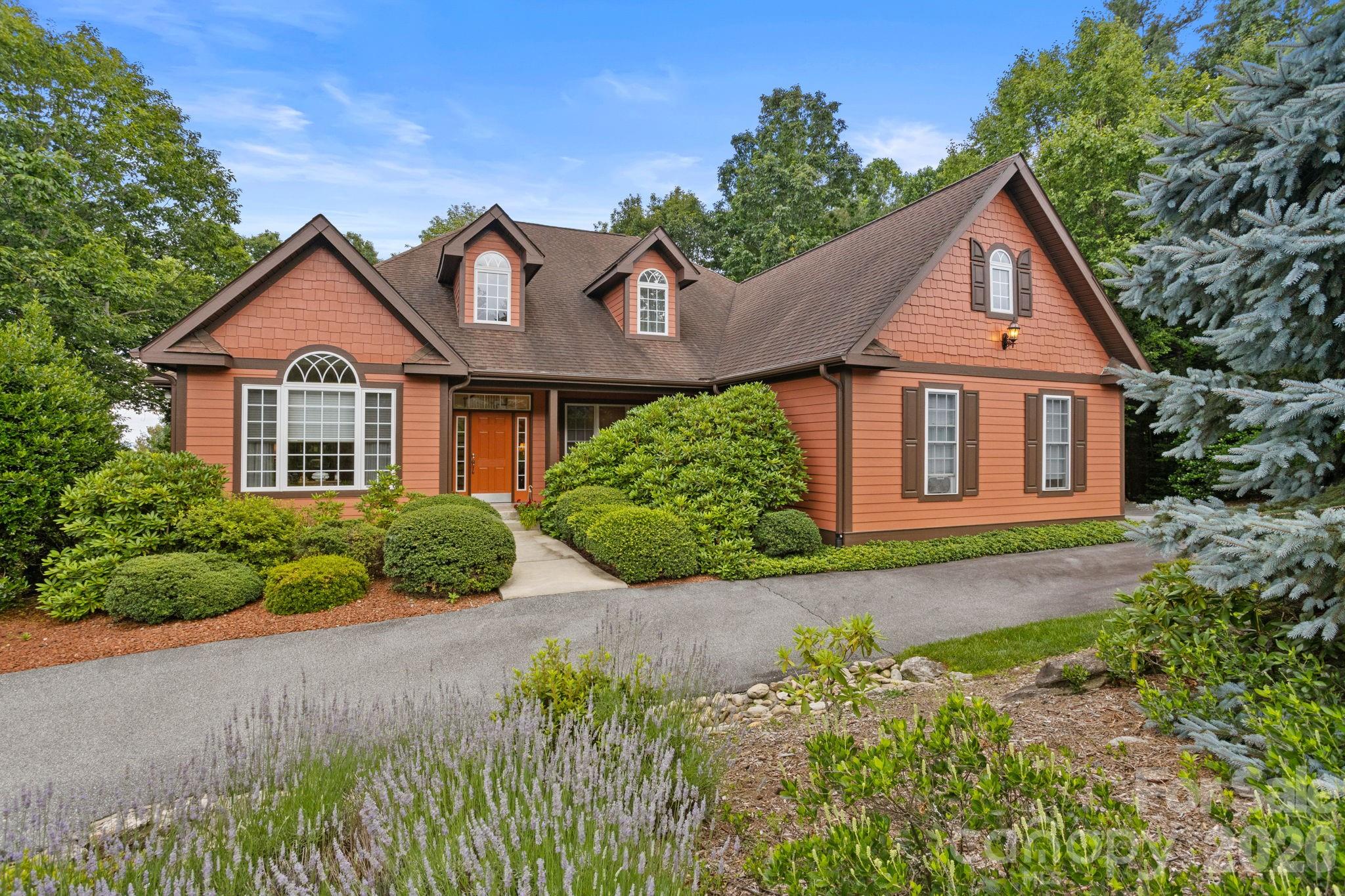Prepare to be impressed by this exceptional custom home nestled on 1.04 mostly level beautifully landscaped acres in one of the most desirable sections of Kenmure- a prestigious gated golf course community. Offering 4 bedrooms, 3.5 baths and a 3-car garage, this remarkable residence boasts outstanding curb appeal with a circular driveway, four impressive stone columns with lighting, a welcoming covered rocking chair front porch and exceptional privacy. Step inside the inviting foyer with vaulted ceilings and discover exquisite craftsmanship, timeless design and an ideal floor plan where each room flows seamlessly into the next. Rich oak hardwood floors extend throughout the main level creating warmth and elegance. The spacious great room features 9-foot ceilings, a beautiful gas fireplace, abundant windows that fill the home with natural light and direct access to the deck complete with a retractable awning. The chef’s gourmet kitchen is designed to impress with an abundance of cherry cabinetry, granite countertops, a large center island, pantry, gas cooktop, double wall ovens, Bosch dishwasher, built-in desk area and generous workspace. The kitchen along with the adjoining breakfast area flows effortlessly into both the great room and formal dining room creating the perfect setting for entertaining and family gatherings. The elegant dining room showcases 9-foot ceilings, an arched entryway and a large picture window overlooking the beautiful grounds. A wonderful den or study with a wall of windows and custom built-in bookcases with drawers provides the perfect home office, library or television room. The main-level primary suite offers 9-foot ceilings, wall of windows, a spacious walk-in closet with custom built-ins and a spa-inspired bath featuring double granite vanities, a garden tub with decorative tile surround and a walk-in tiled shower with multiple body sprays. Completing the main level are a beautifully appointed powder room with pedestal sink, spacious laundry room with cabinetry and utility sink and under stair wine closet. The upper level offers three spacious guest bedrooms and two full baths. One bedroom serves perfectly as a second primary suite or bonus room with its own private en-suite bath, while the remaining bedrooms share a beautifully designed bath featuring dual pedestal sinks, a tiled tub/shower combo and abundant closet space. Outdoor living is equally impressive. Relax on the covered front porch or unwind on the rear deck with a retractable awning and convenient gas line for grilling while enjoying the peaceful mountain setting. Recent updates include brand-new HVAC systems, a whole-house generator and recently painted exterior providing peace of mind for years to come. Conveniently located near the entrance gate and just minutes from Kenmure’s outstanding amenities including championship golf, clubhouse, dining, fitness center, indoor and outdoor pools, tennis, pickleball and more. This extraordinary home offers the perfect blend of luxury, comfort, privacy and quality craftsmanship, making it ideal for full-time living or a mountain retreat. A truly exceptional opportunity that will impress even the most discerning buyer.