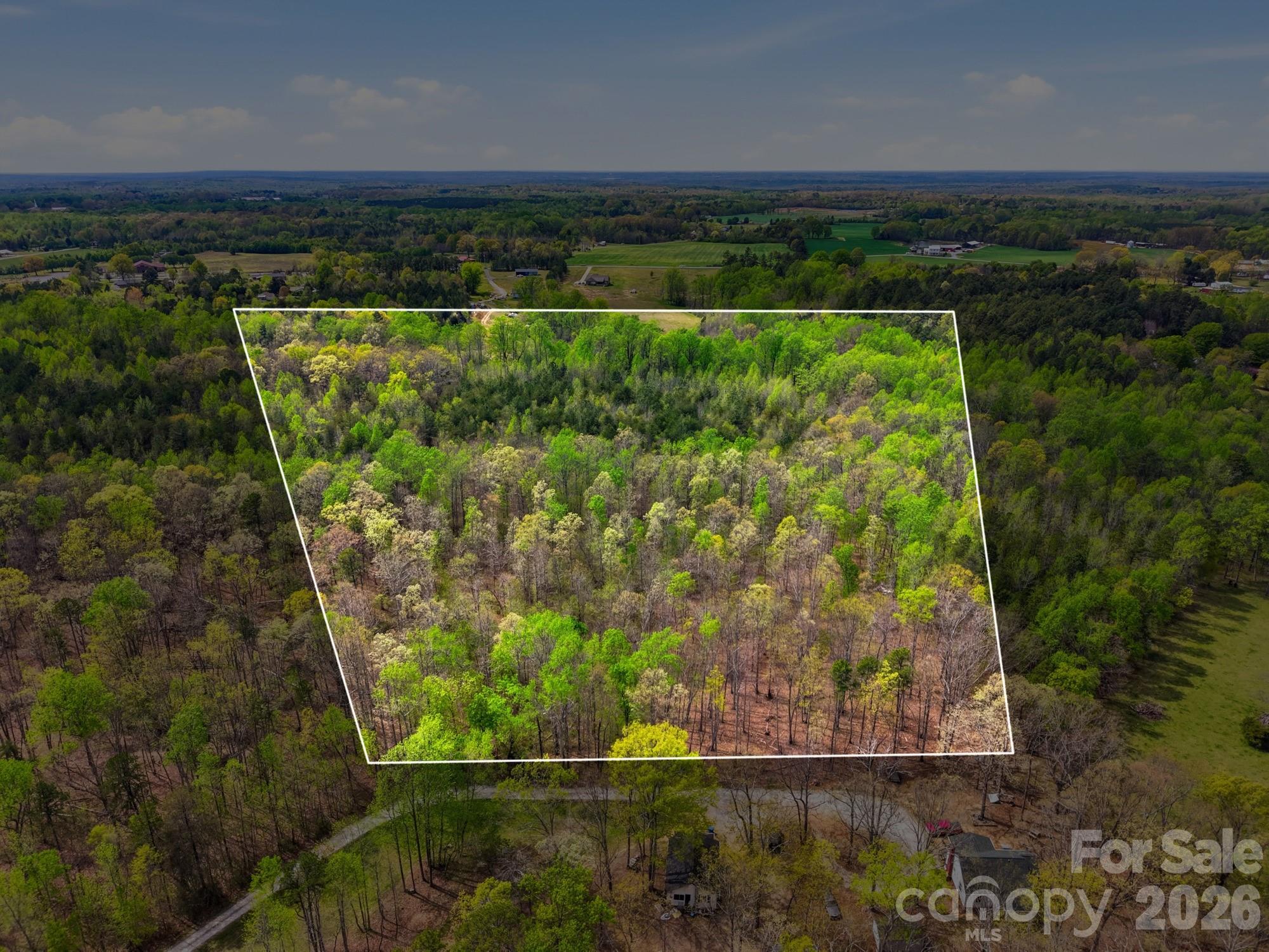 Gorgeous private wooded 10.80-acre lot ready for your dream home! Picture finding an affordable, spacious tract just outside Charlotte—close enough for an easy daily commute. Here, you’ll have room for all your outdoor gear, toys, privacy, and natural beauty. So often the perfect parcel is overpriced, too far out, or stuck in a floodplain—but not this one! Get it perc tested and build exactly what you want.