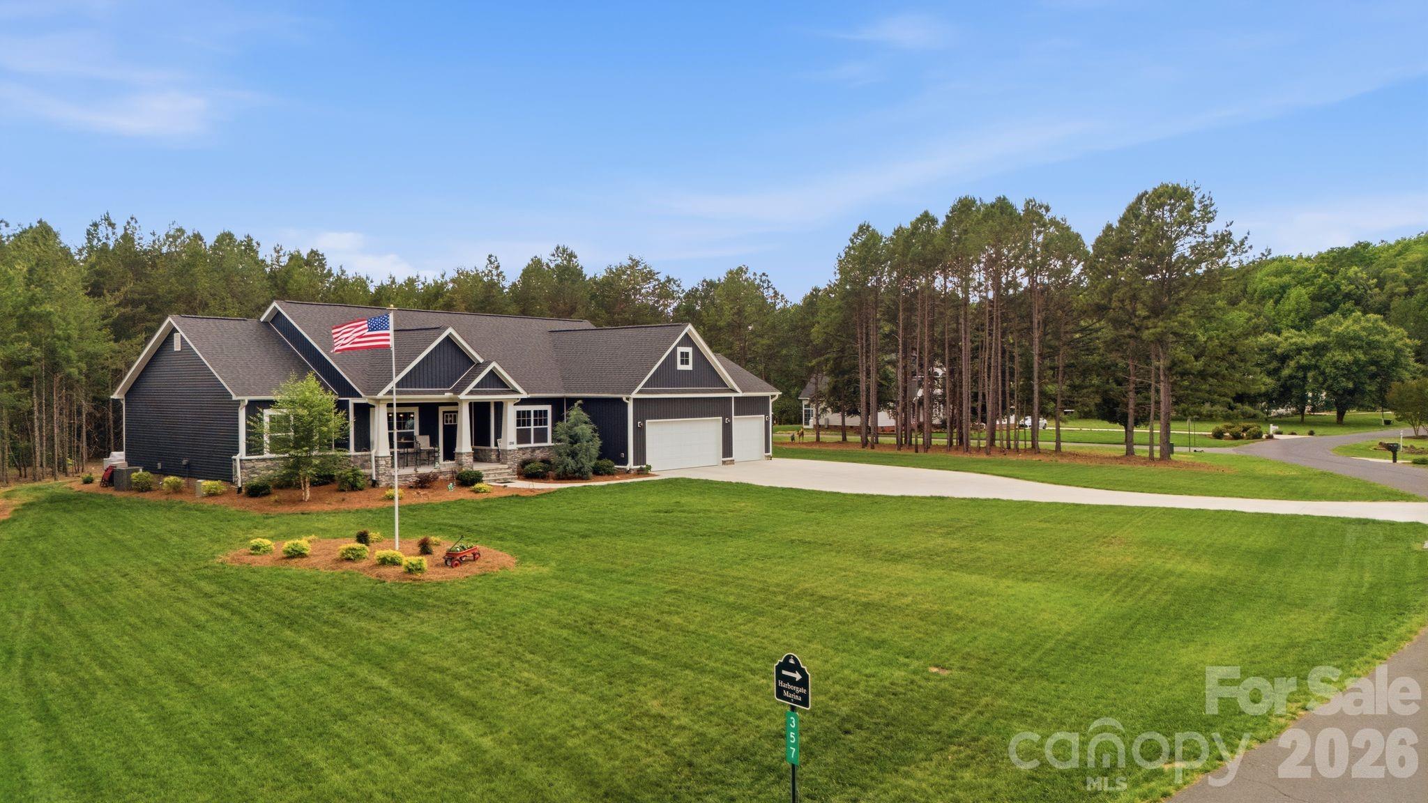 2023 ONE LEVEL home w/ 3 CAR garage (w/ beautiful epoxy flooring) sitting on level double lot w/ LAKE VIEW DIRECTLY across the street from the WATERFRONT Harborgate Marina w/ private community boat ramp & boat storage lot! Primary w/ double walk-in closets, & flexible bonus room ideal for an office. Kitchen features a large pantry & flows into the main living area. Enjoy the sunroom/screened porch! Property includes a full irrigation system (40+ sprinklers). 3-car garage also offers cabinets, workbench, hanging storage, & an overhead storage platform! Energy-efficient w/ Tesla solar panels to provide energy for the home & your EV car or truck too!  In addition to the conventional HVAC system, option to use the mini split to lower your utilities even further! Robotic mowers may be included with an acceptable offer! Other HOA amenities include - Clubhouse, pool, tennis courts, & park! Preapproved buyers welcome!