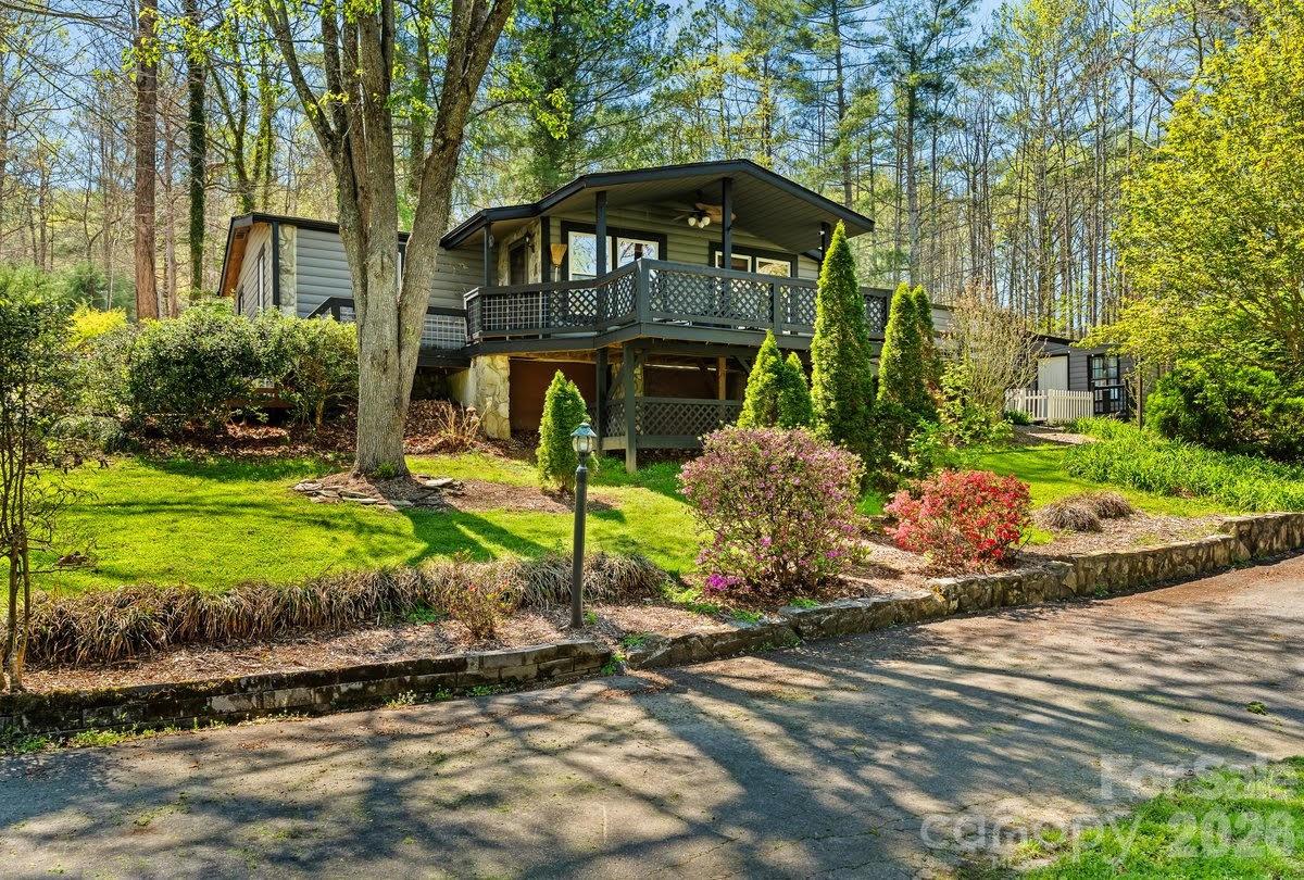 This charming property offers a peaceful retreat in the highly desirable Fairview area, perfectly balancing privacy with everyday convenience. Situated on nearly half an acre, the setting provides a sense of seclusion while remaining just a short drive to Asheville, Hendersonville, and essential amenities. A cozy log-sided exterior and inviting covered front porch create a warm first impression, leading into a spacious and flexible interior. The home features two comfortable bedrooms along with two additional bonus rooms, ideal for guests, a home office, or creative space. Outdoor living is equally impressive. The large, fully fenced backyard is designed for both relaxation and inspiration, featuring a dedicated art studio or workshop with electricity (currently being used as movie room), as well as a tranquil gazebo overlooking a picturesque koi pond. A generous wrap-around deck extends the living space outdoors, offering the perfect setting for entertaining or simply enjoying the surrounding natural beauty. Additional highlights include new roof (2025), RV parking for those who love to travel, along with highspeed internet to ensure seamless connectivity for work or leisure. A substantial detached garage, complemented by two covered carports, provides ample room for vehicles, equipment, and storage needs. Thoughtfully combining functional features with serene surroundings, this property presents an exceptional opportunity to embrace a balanced lifestyle. Whether you're seeking a full-time residence, a creative retreat, or a versatile home base close to vibrant city amenities, this Fairview gem delivers comfort, character, and convenience in one inviting package.
PLEASE NOTE: In addition to 1295 SF of living area, the following square footage has not been included in the 1295 SF-  due to ceiling height (6' 8") : 1. Primary Bedroom & Bathroom (330.82 SF)
2. Office (182.66 SF)