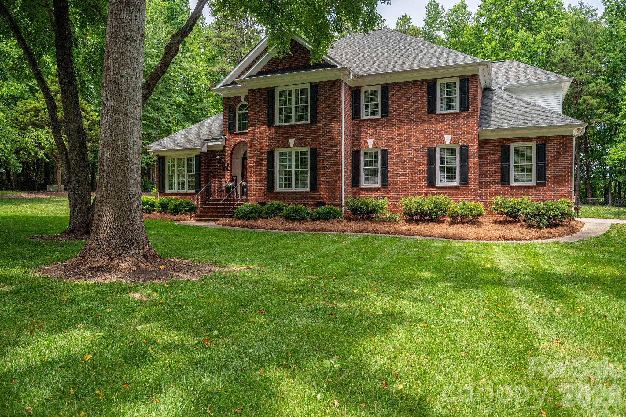 Nestled on over two picturesque acres, this beautifully remodeled full brick home offers the perfect blend of timeless charm, modern updates, and exceptional privacy. Positioned in the heart of the property, the home is surrounded by mature, thoughtfully placed trees that create a stunning first impression as you travel down the driveway.

Inside, you'll find a well-designed floor plan featuring a spacious primary suite on the main level, a dedicated study, formal dining room, and an inviting eat-in kitchen that serves as the heart of the home. Upstairs offers two additional bedrooms along with a versatile flex space that can function as a bonus room, guest suite, playroom, home gym, or whatever best suits your lifestyle.

Designed for both everyday living and entertaining, the screened-in rear living area provides the perfect place to relax, host gatherings, or simply enjoy the peaceful surroundings year-round. The meticulously maintained grounds are enhanced by a full in-ground irrigation system that services the entire property, keeping the landscape lush and beautiful.

Additional features include a spacious three-car garage and an abundance of walk-in attic storage rarely found in today's homes. Lovingly maintained and thoughtfully improved over the past nine years, this exceptional property reflects pride of ownership at every turn. If you've been searching for space, privacy, and a move-in ready home on acreage, this one is truly a rare find.