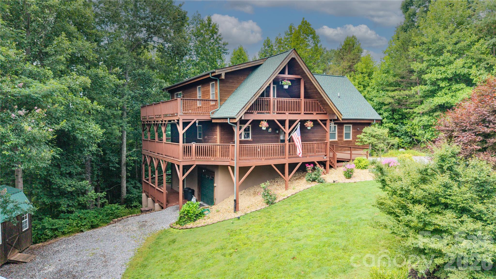 Welcome to your mountain retreat in the desirable gated community of Hidden Lake! This custom-built 3-bedroom, 3-bathroom cabin perfectly blends rustic charm with recent modern updates, offering the peaceful lifestyle you've been searching for.
Step inside to the inviting open floor plan, highlighted by soaring cathedral ceilings, exposed beams, an abundance of natural light and beautiful Australian cherry hardwood floors. The spacious living area flows seamlessly from the kitchen and dining space to the great room which features a gas insert fireplace and access to a screened-in porch; creating the perfect setting for relaxing or entertaining family and friends.
The main level bedroom features its own cathedral ceiling and outside access, providing a warm and airy retreat. Upstairs, the second bedroom features a private deck overlooking the South Mountain range, a perfect spot to enjoy the peaceful outdoors. You’ll find the third bedroom in the basement with direct access to the beautiful, private backyard. 
Recent updates provide peace of mind, including a new roof and HVAC system, and all exterior decks have been freshly re-stained, allowing you to immediately enjoy the home's abundant outdoor living spaces. The hand-scraped cedar furniture is negotiable.
Whether you're searching for a full-time residence, a mountain getaway, or an investment opportunity (STRs are permitted) this exceptional cabin offers timeless craftsmanship, is surrounded by nature, and provides the security and privacy of the gated Hidden Lake community. Don't miss your opportunity to own this beautiful, one-of-a-kind mountain home!