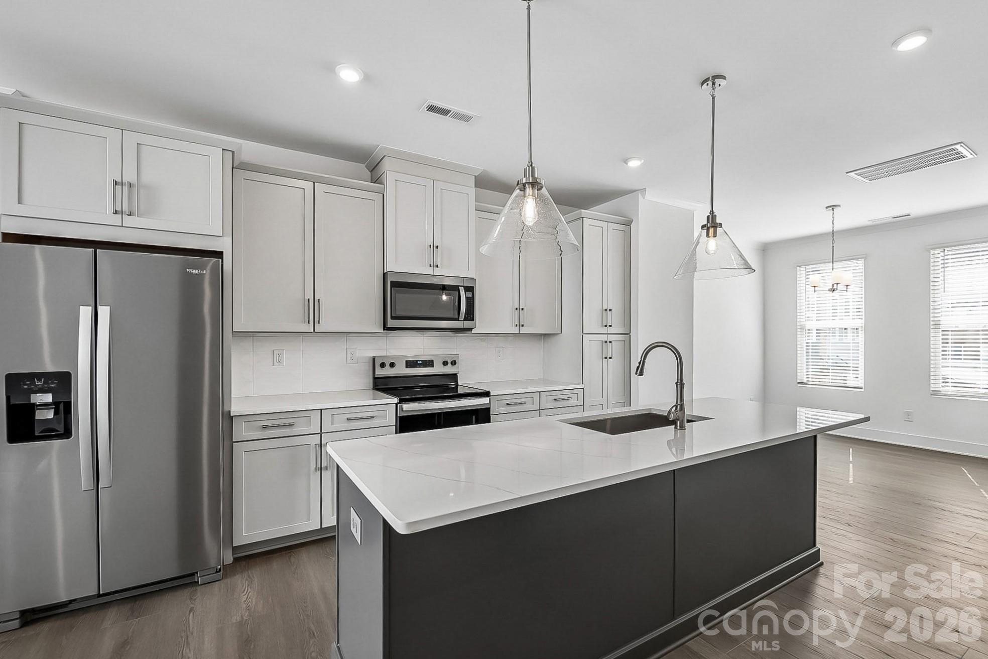 2 miles from BOA Stadium, minutes from Optimist Hall, and less than a mile from the AvidXchange music factory. Iron Creek is a luxury townhome community with an exquisite selection of four-story townhome designs featuring rooftop terraces and 2-car garages. Finance incentives available.
This Dunhill floorplan showcases versatile living spaces designed with your city lifestyle in mind. The main living area is highlighted by a spacious great room, casual dining area, a well-crafted kitchen with access to the outdoor, rear balcony. On the third level, the primary suite is enhanced by a large walk-in closet and a lavish private bath featuring dual vanities and a luxe shower with a bench seat. Adjacent, the guest bedroom features an en-suite bath and roomy closet. The fourth floor has another bedroom perfect for an office with great views from the stunning, rooftop terrace.