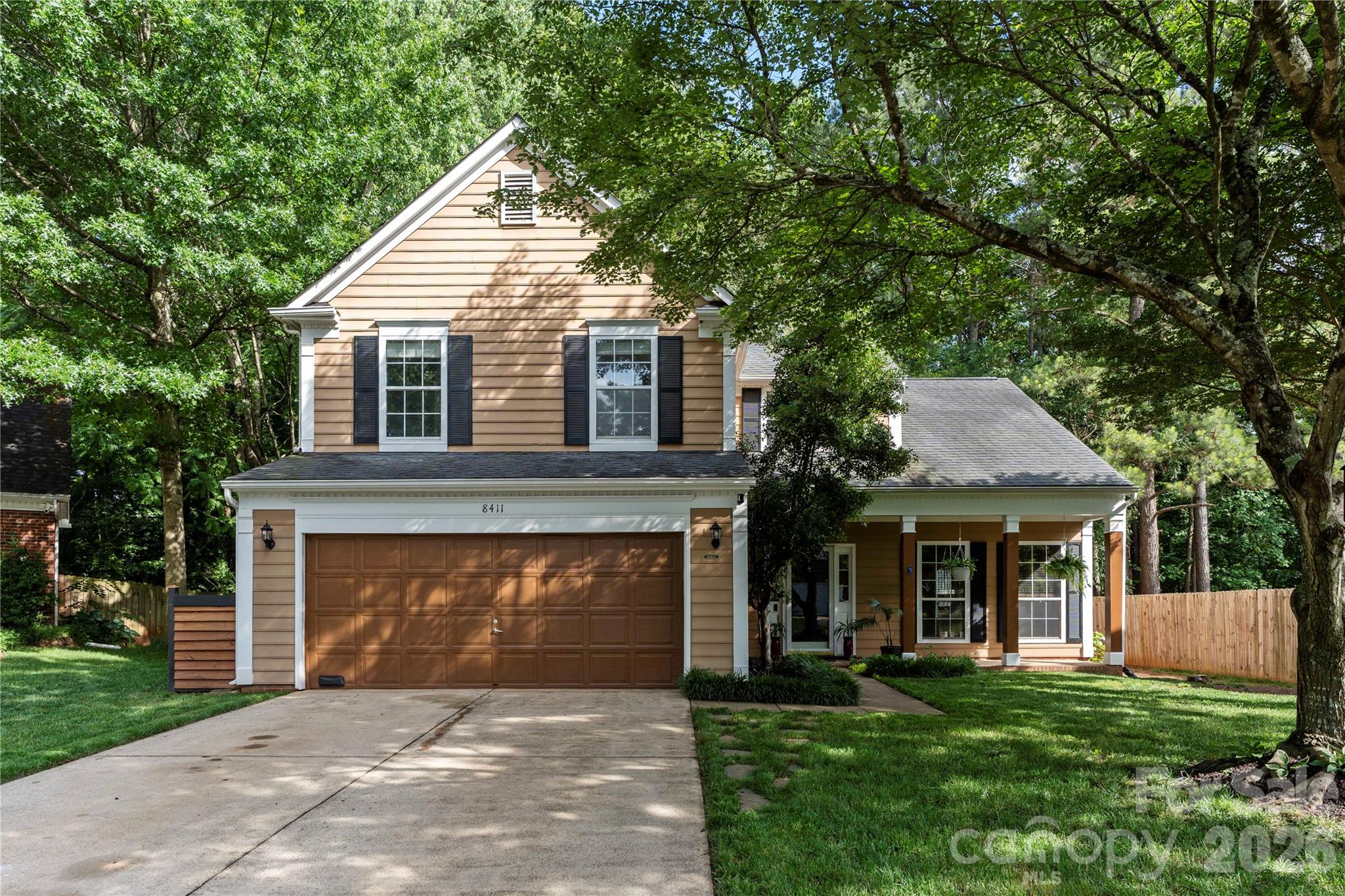 Beautifully maintained home tucked away on a quiet cul-de-sac in the desirable Wedgewood North community! Situated on a spacious lot with a large front yard, this property offers exceptional curb appeal with a decorative fish pond, lighted curbside landscaping, and an extended driveway leading to a 2-car garage. Inside, you'll find a bright and inviting floor plan featuring a dramatic vaulted great room, formal dining area, and a recently renovated kitchen that seamlessly flows into the breakfast area and main living spaces. The primary suite is conveniently located on the main level and boasts a vaulted ceiling, spacious walk-in closet, and private bath with garden tub, separate shower, and water closet. Upstairs offers two additional bedrooms and a full bath. Step outside to your own private backyard retreat featuring a covered deck, expansive patio, additional entertaining decks, stone pathways, greenhouse, swing and sitting areas, sundeck, and a stunning lagoon-style koi pond. The fully fenced backyard backs to mature woods, creating a peaceful and private setting perfect for relaxing or entertaining year-round.
