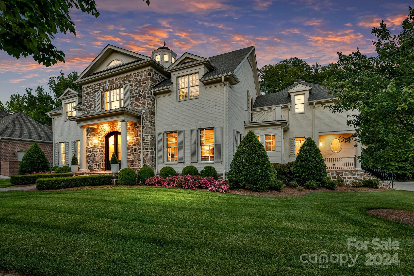 Exquisite custom home built and completed in 2016 by premier builder Artisan Custom Homes located in Davidson. Incredible upgrades and craftsmanship throughout home and beautifully designed by the talented JJ Barja with Elite Design Group. This luxury home has 5 bedrooms, 5 full baths, 2 half baths with a large .73 acre professionally landscaped lot. This is the perfect home for entertaining family and friends with an exceptional open floor plan design. The intricate ceiling detail, very upgraded trim/moldings, curved staircase, chef's kitchen with large island, high-end appliances with Wolf Range, Sub-Zero and primary bedroom on the main level are all absolutely stunning. It's easy to relax in this very private and tranquil setting watching the sun rise on your beautiful covered porch that overlooks your gorgeous pool. Location is superb in the highly sought after Davidson Wood neighborhood. Walk or bike into the charming town of Davidson to shop and enjoy the many fine restaurants!