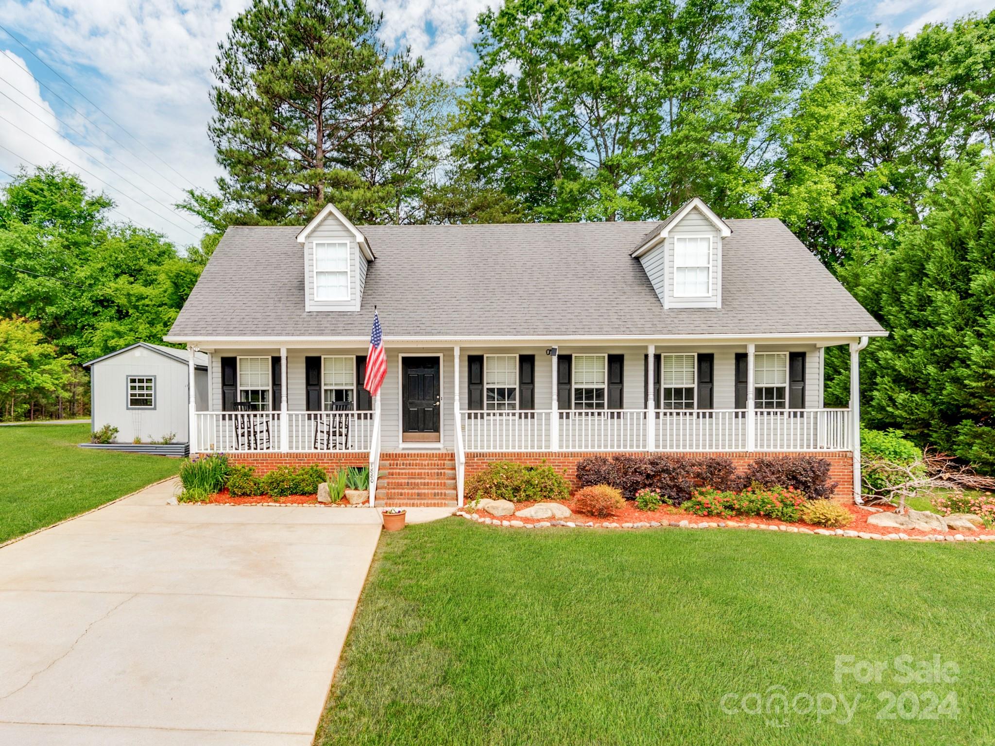 Gorgeously Remodeled 3 Bed 2 Bath Ranch Home with Rocking Chair Front Porch! New Roof! New Flooring and Fresh Paint throughout. Updated Kitchen features All New Cabinets, Butcher Block Countertops, Brick Backsplash, and New Frigidaire Black Stainless-Steel Appliances. Refrigerator, Washer, and Dryer Included. Updated Hall Bathroom features New Tile Shower with Bench Seat, New Toilet, and New Vanity. Master Bedroom with Tray Ceilings and Large Walk-In Closet. Updated Master Bath features Luxury Garden Tub with Tile and Glass Doors. New Toilet and New Vanity as well. All Light Fixtures Updated. New Attic Fan to Help Keep the House Nice and Cool during the Summer Months. 2020 HVAC. Home comes with a Utility Shed and Newer 12x20 Shed Fully Wired with Additional Circuit for a Mini Split Air Conditioner. New Vapor Barrier in Crawl Space. Landscaping Updated with New Paver Patio and Fire Pit. NO HOA! Easy to Show!