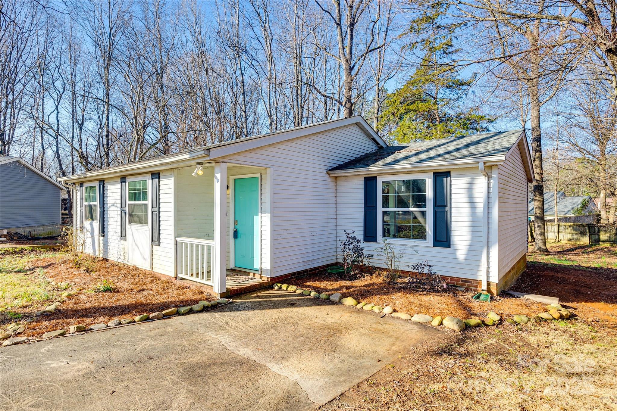 Welcome home to this delightful 2 bed, 1 bath ranch-style home nestled on a quiet cul-de-sac in The Wildwoods neighborhood. Situated on a spacious .32 acre lot, this charming residence offers 976 sq ft of living space. The bright and inviting living areas provide the ample space to relax, while the well-equipped kitchen ensures meal prep is a breeze. The huge back yard is partially wooded, offering privacy and space between your neighbors.  Enjoy the proximity to local shopping, dining, and schools. With no HOA and easy access to W.T. Harris Blvd, this property is a fantastic opportunity and excellent value. Don't miss it!