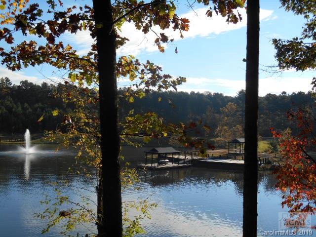 1.76 acre wooded lot in cul-de-sac, level building area.  Gated community located on Lake Hickory includes clubhouse, swimming pool, stocked fishing lakes, paved hiking and bike trails.  This property is located on the water front of Emerald Lake with a beautiful view of the fountain and located near the community dock.  Over 20 private and public golf courses located nearby.