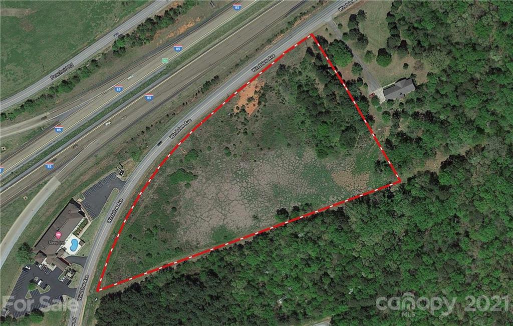 6 development acres on Exit 90 in Gaffney with excellent I-85 visibility. This site has it all, easy direct access with water, sewer and fiber optic on site and in an opportunity zone as well and is located in Cherokee County just outside the Gaffney city limits. The parcel is located on Windslow Road which is the frontage road running parallel to I-85. The site is directly across I-85 from Hamricks which is beside the Outlet Mall and is across the street from the Sleep Inn. The parcel is relatively flat for easy site preparation and could be ideal for hotels, retail, industrial, distribution, truck stops, maintenance, corporate locations, multi family, townhomes or an apartment complex. If 6 acres is too much, outparcels can be created to meet your needs. Close proximity to Red Roof Inn, Bojangles, Zaxbys, QT and many other businesses.