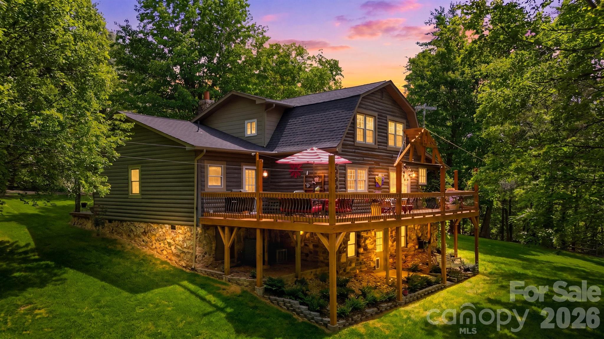 Escape to your own private mountain retreat with this majestic log home nestled on 7.52 beautiful acres offering exceptional privacy and a picturesque natural setting. Warm and inviting, this home features a stunning great room with wood beam ceilings and a gorgeous stone fireplace that serves as the heart of the home. The thoughtfully designed kitchen offers a functional layout with an adjoining dining area, perfect for everyday living and entertaining, along with a convenient half bath for guests. The main-level primary suite provides comfort and convenience with a walk-in closet and attached laundry area. Upstairs, you’ll find three additional bedrooms and a full bath, offering plenty of space for family and guests (septic permit is for 3 bedrooms). The partially finished basement includes a spacious recreation room, half bath, and additional storage space. Step outside and take in the beauty of the surrounding landscape from the expansive porches that wrap around most of the home. The outdoor living spaces are truly special, featuring a beautiful gazebo, custom pizza oven with patio area, and even a charming treehouse tucked among the trees, creating the perfect setting for relaxing or entertaining. A detached 2-car garage and additional storage shed complete this one-of-a-kind property. This one is a true gem!