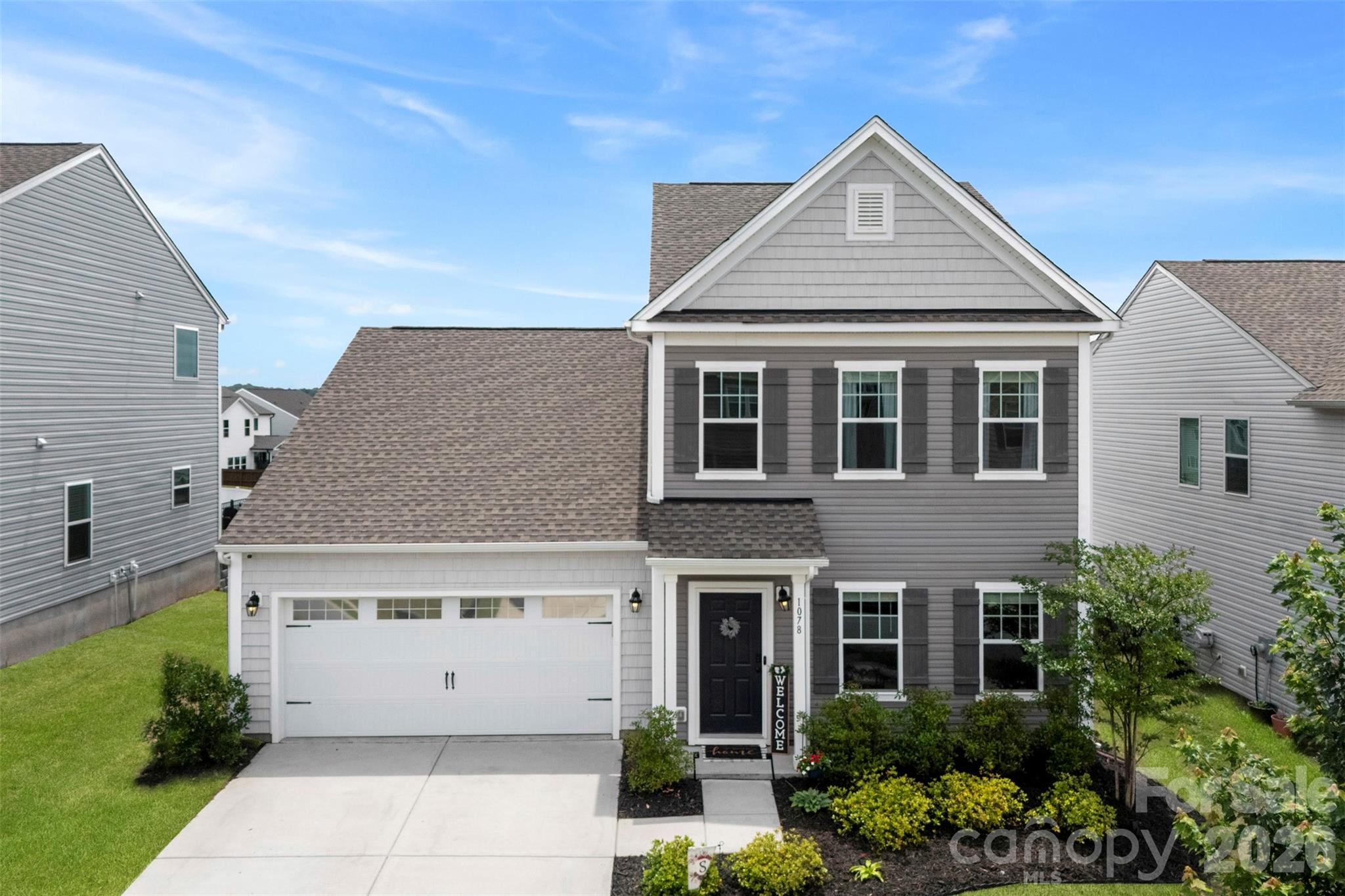 Built in 2021 and move-in ready, this 3-bedroom plus loft home in Concord was designed for those who like an open, connected layout. The main level keeps the kitchen, dining, and living areas in the same flow; so whether you're cooking or cleaning up, you're not missing the conversation. The large island pulls double duty as a prep space and a gathering spot, and the quartz countertops, stainless steel appliances, and white cabinetry make the kitchen as functional as it looks. Four-panel sliding glass doors line the back wall of the living area, flooding the space with natural light and opening directly to a fenced backyard with an extended patio. Updated flooring and light fixtures throughout the living areas. Both the Primary bedroom and laundry room are on the main level. Upstairs, two additional bedrooms each have great closets, plus a loft that gives you room to grow into, whether that's a home office, playroom, or extra living space. At just five years old, the major items are already taken care of. Very well maintained home in a great location and neighborhood!