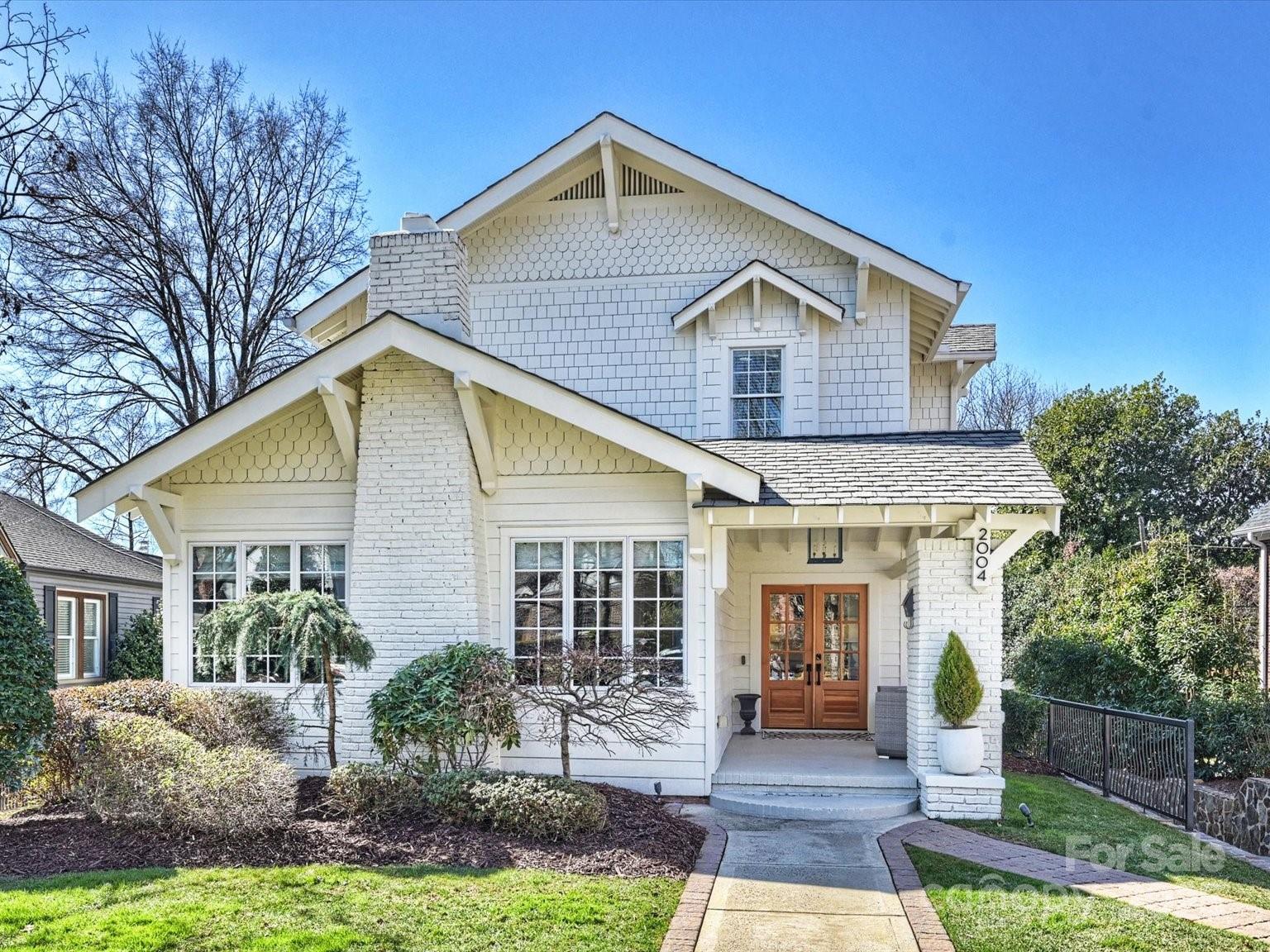 A truly stunning Masterpiece in an unbeatable location on Freedom Park. This 2007 constructed Craftsman home has 1 room remaining from the original 1935 structure. One of only a handful of homes with Gorgeous Views inside of Freedom Park! This location offers walkable access to East Blvd. restaurants and shopping, including Myers Park and Dilworth.  
 The Main level includes your 1935 Speakeasy (Marble surfaces), beautiful formal dining, 1 full bath, office or bedroom, and massive open concept Chef’s Kitchen with great room area that was fully upgraded in 2025. Massive upper deck features entertaining area overlooking a heated Pool, Perimeter overflow oversized Spa, water wall, and Fire-bowl feature.  The oversized Primary bedroom with more unbeatable views of Freedom Park features an oversized walk-in closet and en-suite bathroom with heated floors, picture window, marble tops, water closet, and electric shade.