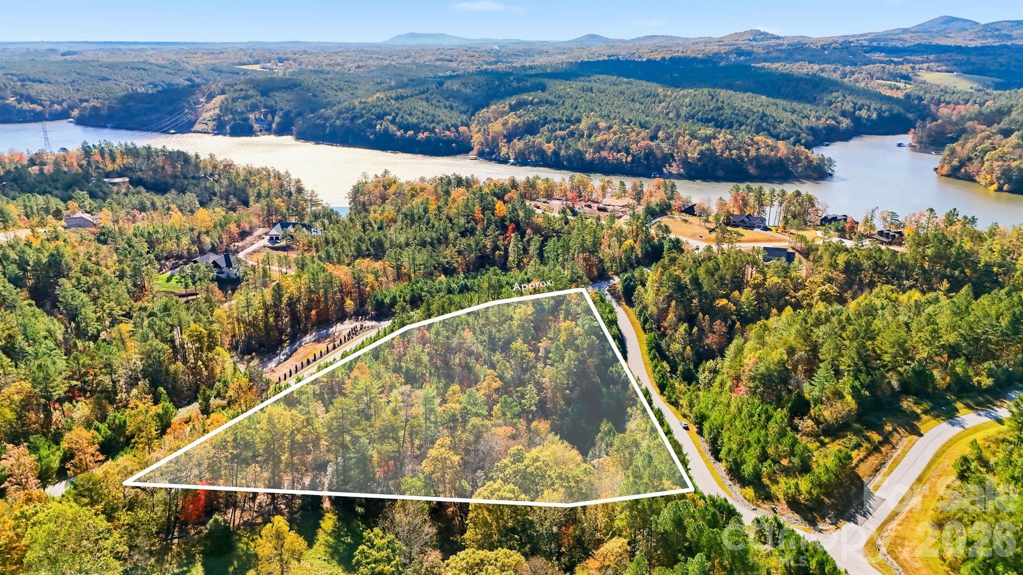 Discover the perfect blend of privacy, luxury, and natural beauty with this 3+ acre lot in the gated community of Edgewater located at Lake Rhodhiss. This parcel offers a prime opportunity to build your dream home or weekend retreat. Enjoy the best of lakefront community living with the neighborhood common area which features private amenities, including a covered pavilion, fire pit, and picnic area. Conveniently located near Hickory, Morganton, and Lenoir, this property provides easy access to shopping, dining, and entertainment while maintaining a peaceful, secluded feel. *lot not suitable for conventional septic system.  Consult soil scientist for more options*