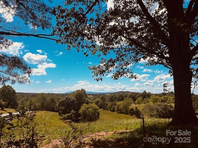 Beautiful 15.7 acre tract.  Just off Hwy 10 West with easy access to Hickory or Newton.   Fabulous huge trees frame the setting for the perfect spot to build your dream home. Stunning views of rolling pasture bordered by tress.   Wooded area at rear of property borders stream.  Large older barn with loft and shed. Pasture has been maintained under a lease which owner says expires at the end of June.  DEED RESTRICTED AGAINST POULTRY AND SWINE OPERATIONS.   
See MLS# 425467 for available adjoining 1.86 acres.
