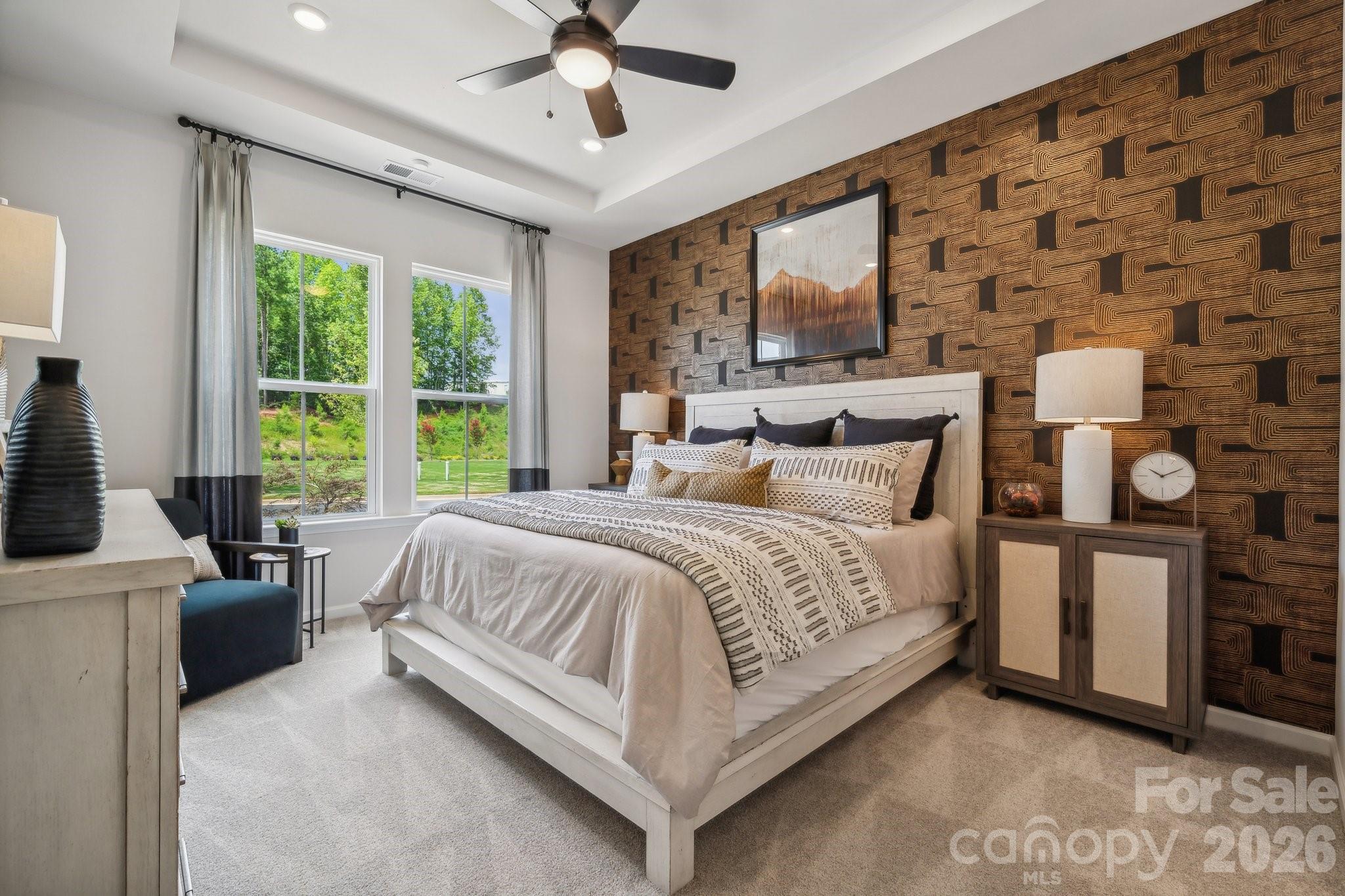 What's Special: Multi-Gen Suite | Tub in Primary Bath | Dedicated Study | 2nd Floor Laundry Room. New Construction - July Completion! Built by America's Most Trusted Home Builder. Welcome to the Tahoe at 3165 Beacon Heights Road in Ridge at Sugar Creek! This stunning new end-unit townhome welcomes you with an open-concept living area where the great room flows naturally into the bright kitchen and casual dining space. The kitchen shines with a center island and a large walk-in pantry. A main level primary suite with an en-suite bath and walk-in closet sits just off the great room, while a powder room is tucked near the rear garage entry. Upstairs, a dedicated study creates a comfortable place to focus, alongside two secondary bedrooms with walk-in closets, a full bath and the laundry room. A secondary primary suite completes this level with its spa-inspired en-suite bath featuring a slide-in tub and a generous walk-in closet. Pool and cabana now open! Ridge at Sugar Creek in Indian Land, SC, offers a welcoming lifestyle with a new pool and planned greenway trail. Just 4.5 miles from Ballantyne, you’ll enjoy easy access to I-77, I-485, and the Ballantyne Bowl’s dining and events. Commuting is simple with quick routes to Uptown Charlotte and Ballantyne Corporate Park. Additional Highlights Include: Study in place of loft, upstairs primary suite, tub and shower at upstairs primary bath, upstairs laundry room, ledge at downstairs primary shower, walk-in pantry, and extended laminate flooring to great room. Photos are for representative purposes only.MLS#