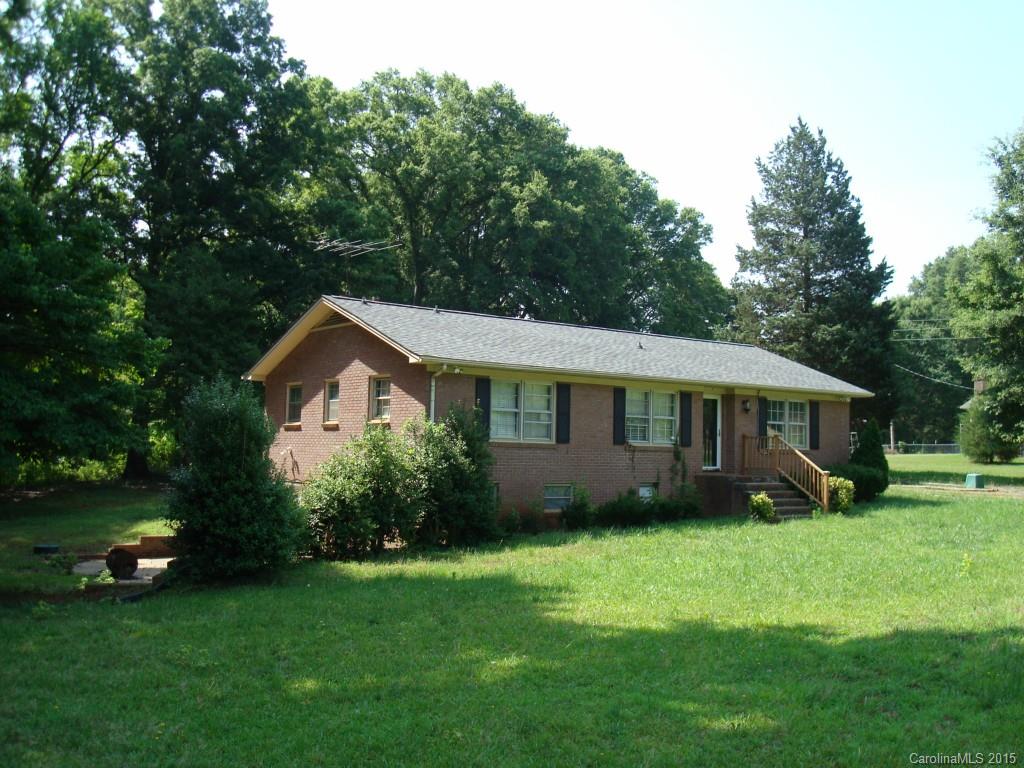 Unique plan w/grt bones & tons of potential needs TLC.  Perfect for FHA 203K or Homestyle loan program.  Newer roof 2013, septic tank, electric water pump for well. Master w/half bath.  Main House w/walk out finished basement incls den/rec/family rm, wood FP, bedroom & full bath.  Breeze way connects main house to in-law house w/kitchen, LR, 2 bdrms & full bath.
