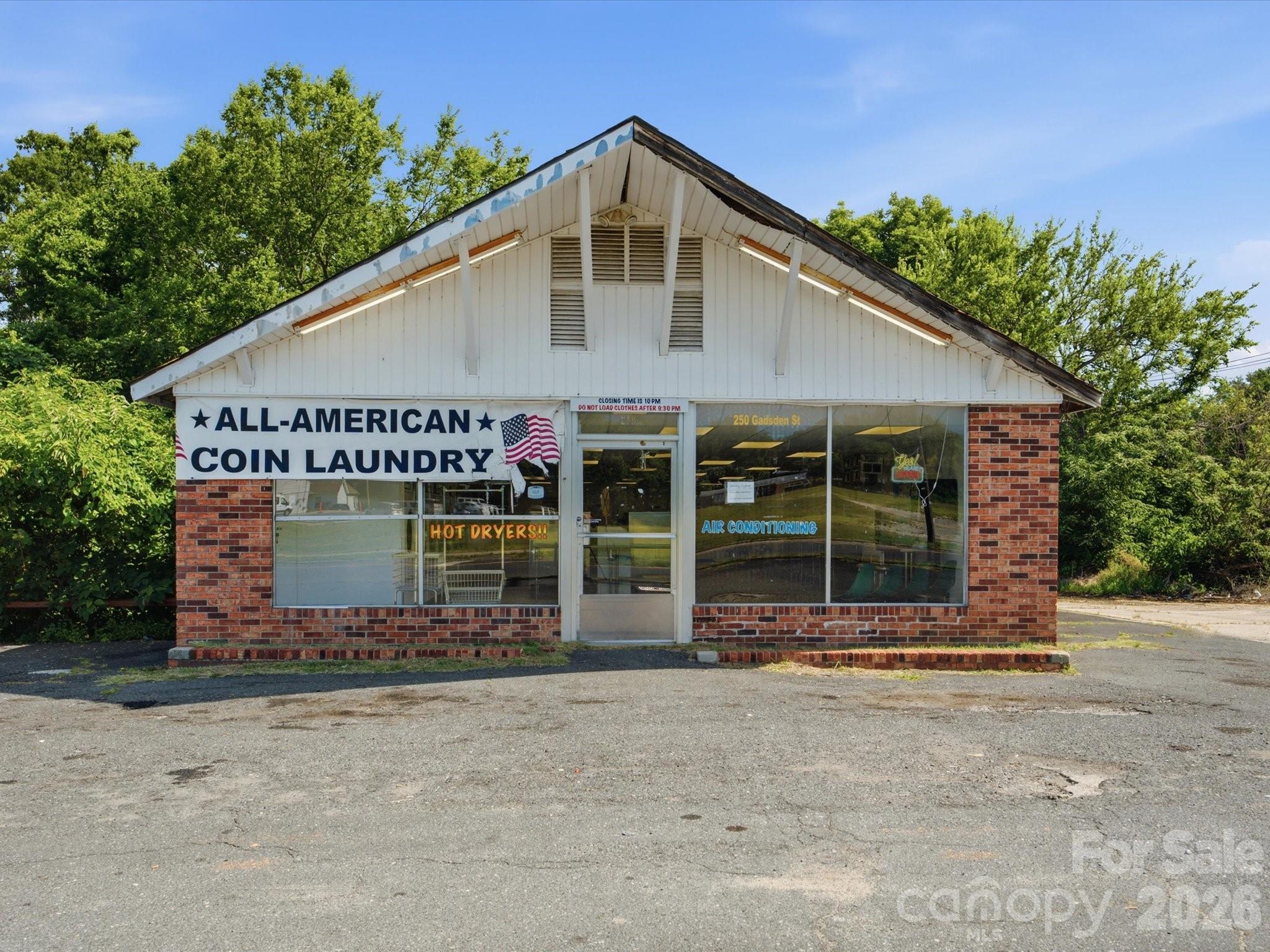 Exceptional opportunity to acquire the commercial real estate at **250 Gadsden Street** along with an established operating laundromat business. This freestanding commercial property is being offered as part of a two-property portfolio sale that also includes **159 Pinckney Street MLS # 4402312.

Situated on approximately 0.52 acres, this established location has served the Chester community for years and provides excellent visibility, convenient customer access, and ample on-site parking. Recent capital improvements include a packaged HVAC unit replaced in 2024 and backflow preventers upgraded within the last four years, helping reduce future maintenance costs for the next owner.

The sale includes the operating business, commercial real estate, furniture, fixtures & equipment (FF&E), and customer goodwill. This is an outstanding opportunity for an owner-operator or investor seeking immediate cash flow with additional upside through equipment modernization, cashless payment systems, wash-and-fold services, pickup and delivery, commercial laundry accounts, and other operational enhancements.

This property is part of a two-property portfolio sale. The list price reflects one-half of the total portfolio purchase price. Both properties offered at a total purchase price of $500,000.