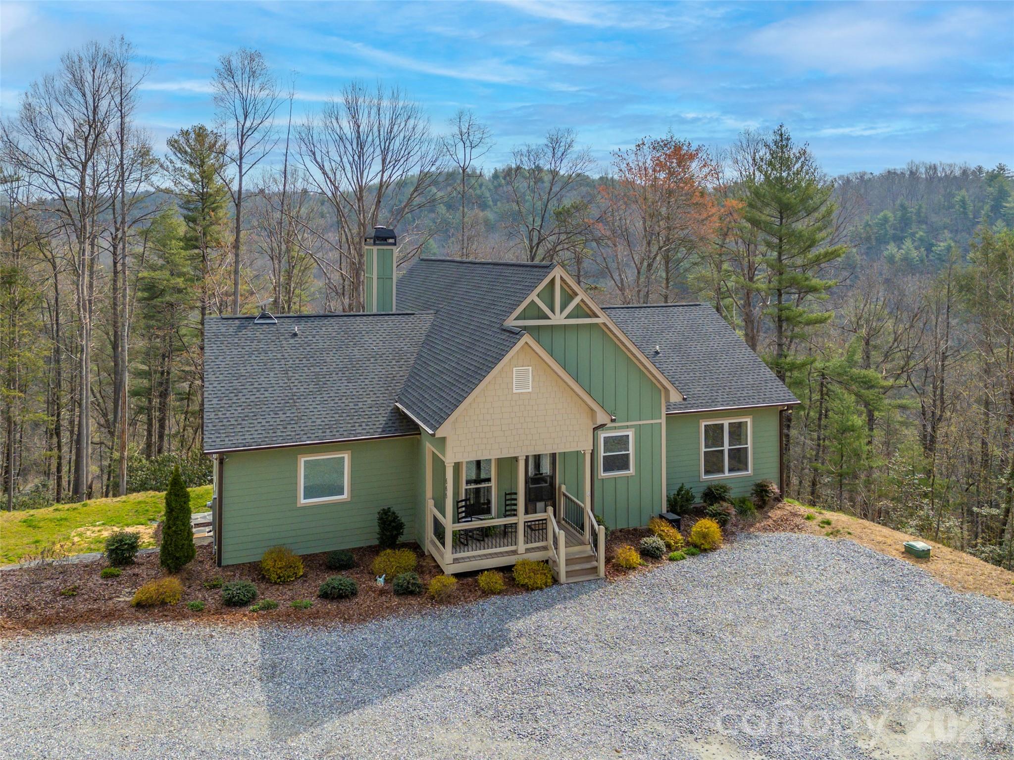 Back on the Market, no fault of sellers!!  Discover peaceful mountain living with the calming sounds of the Green River at this private retreat that borders the Green River Gamelands. Built in 2022 on 4.15 secluded acres, this 4-bedroom, 3-bath home combines modern comfort with natural beauty. Enjoy breathtaking mountain views and the serene river sounds year-round. The open floor plan is perfect for everyday living and entertaining. The main level features three bedrooms, including a spacious primary suite. The finished basement adds a fourth bedroom, family room, and office area—ideal for guests, work, or multi-generational living. Step outside to the fire pit and take in the mountain scenery, or simply relax to the soothing river sounds. This like-new home offers a rare combination of privacy, tranquility, and modern design.