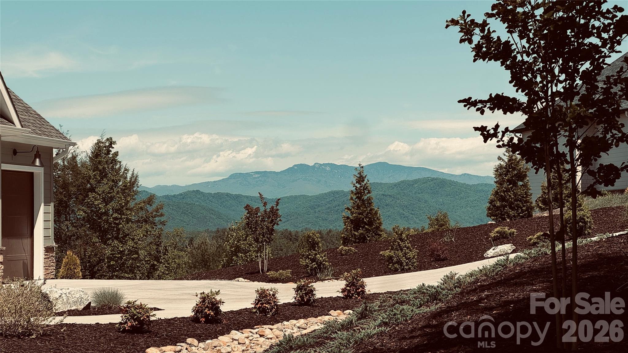 Homesite #1029 at The Coves Mountain River Club offers a rare blend of scale, privacy, and unforgettable scenery across 10.43 acres in one of Western North Carolina’s most sought-after gated communities. Positioned to capture stunning, long-range views of the South Mountain Range, this expansive homesite provides the ideal setting for a luxury mountain retreat with room to design a home that fully embraces the natural surroundings. Located just moments from the community’s signature Pisgah Mountain Lodge, owners enjoy convenient access to one of the most breathtaking vantage points in the region, with sweeping 360-degree views spanning the Blue Ridge, South, and Brushy Mountains, for sunrise coffees or sunset gatherings. The Coves Mountain River Club is thoughtfully nestled along the Johns River and borders over 500,000 acres of Pisgah National Forest, including the renowned Wilson Creek area, an outdoor haven celebrated throughout the Southeast for kayaking, fly fishing, and hiking. Within the gates, residents enjoy over 25 miles of maintained trails suitable for hiking, UTV adventures, and horseback riding. The community lifestyle is equally compelling, featuring a riverside pavilion with outdoor kitchen, firepit, and sandy beach access, as well as a vibrant mix of amenities including pickleball courts, shuffleboard, cornhole, a putting green, dog park, community garden, and even a community vineyard. As a designated dark sky community, evenings here are just as extraordinary as the days, offering unobstructed views of the night sky. Despite its peaceful, tucked-away setting, Homesite #1029 is ideally located just 15 minutes from Lenoir for everyday conveniences like healthcare, banking, dining, and shopping. It’s also within easy reach of Blowing Rock, Morganton, and Hickory, all about 30 minutes away, expanding your options for recreation, culture, and dining. Travel is effortless with both Charlotte Douglas International Airport and Asheville Regional Airport approximately 75 minutes away. Homesite #1029 is more than land, it’s an opportunity to create a legacy mountain property surrounded by nature, amenities, and unmatched views.