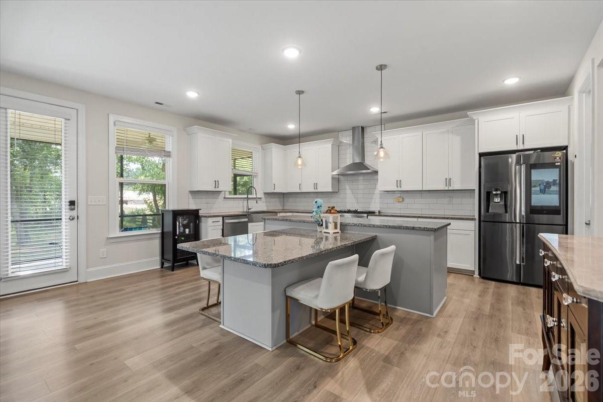 Updated pricing and a 2.75% Assumable VA Loan Available — ask your agent for details.

Private. Modern. Move-in ready. This 2022 Rykar-built farmhouse sits on a full acre in Clover with no HOA, no city taxes, and access to top-rated Clover ISD schools — a combination that's nearly impossible to find at this price point.

The chef's kitchen is built to impress: Verona 36" dual fuel range, Azul Platino granite countertops, a Ludington farmhouse sink, massive walk-in pantry, and a custom island with a built-in granite table. The great room anchors the main level with a slate fireplace and rustic wood mantle. Also on the main level — a private office with French doors, a guest bedroom, and a full bath.

Upstairs, the primary suite delivers: tray ceiling, dual granite vanities, walk-in closet, and a fully tiled spa shower. Three additional bedrooms, a bonus/rec room, two full baths, and upper-level laundry round it out.
3,406 sq ft | 5 bed | 4 bath | 2-car garage | Screened rear porch | Tankless water heater | Washer/dryer included.

The assumable VA rate alone could save a qualifying buyer hundreds per month. This home is worth a serious look.