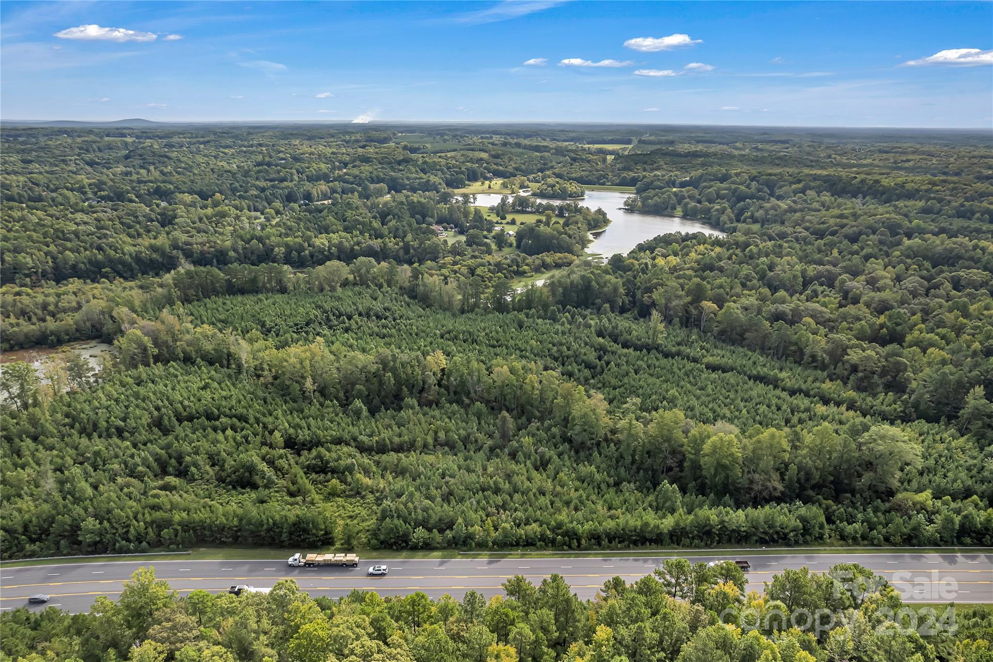 Approximately 35 Acres along Alexander Love Hwy with many options.  Land is currently in farm use program. With rezoning county/city approval you can develop for what you are looking for.  Part of property is in city limits and part is in the county.  Parcels 3500000002/0701601065 located in York, SC, with close proximity to shopping, grocery, and schools.  There is additional acreage as a part of parcel that is part of lake.