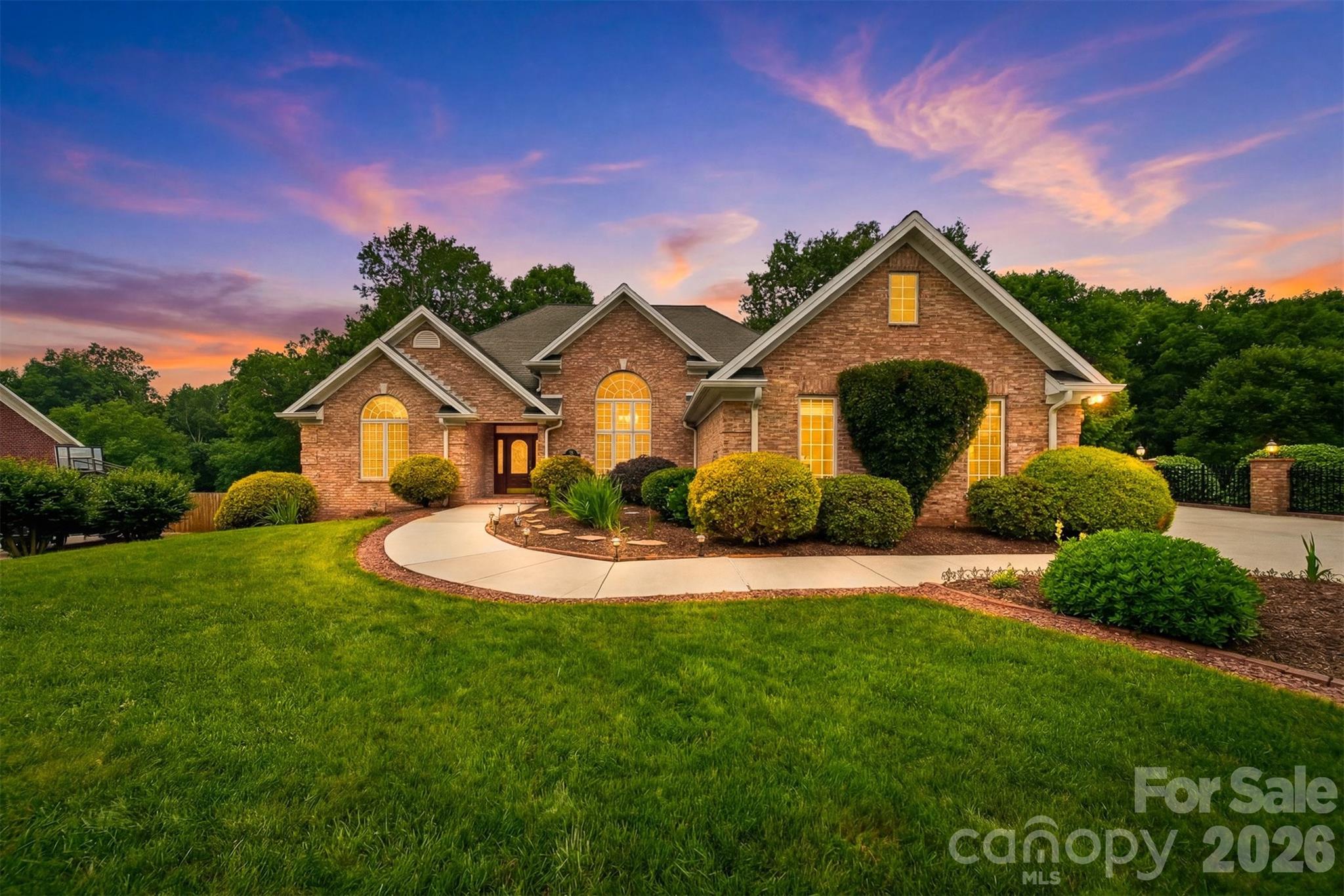Welcome to 18 Mallard Ct, a beautifully maintained brick residence nestled in The Greens, one of Granite Falls’ most desirable residential settings near golf and lakefront lifestyle amenities. Thoughtfully cared for and privately situated in a non-HOA community, this home offers a refined balance of architectural presence, comfortable living, and outdoor beauty. Inside, soaring ceilings create an impressive sense of scale, while the main-level primary suite, generous gathering spaces, and finished basement living area provide flexibility for everyday living and entertaining. The lower level includes a bonus/flex room previously used as a bedroom, offering additional versatility for guests, hobbies, office space, or recreation. Outdoors, mature landscaping, terraced grounds, and inviting exterior living areas create a polished backdrop for quiet mornings, relaxed evenings, and memorable gatherings. Meticulously maintained and positioned in a highly desirable Granite Falls location, this rare offering delivers lifestyle-driven value for discerning buyers seeking space, setting, and timeless appeal. Schedule your private showing of 18 Mallard Ct.
